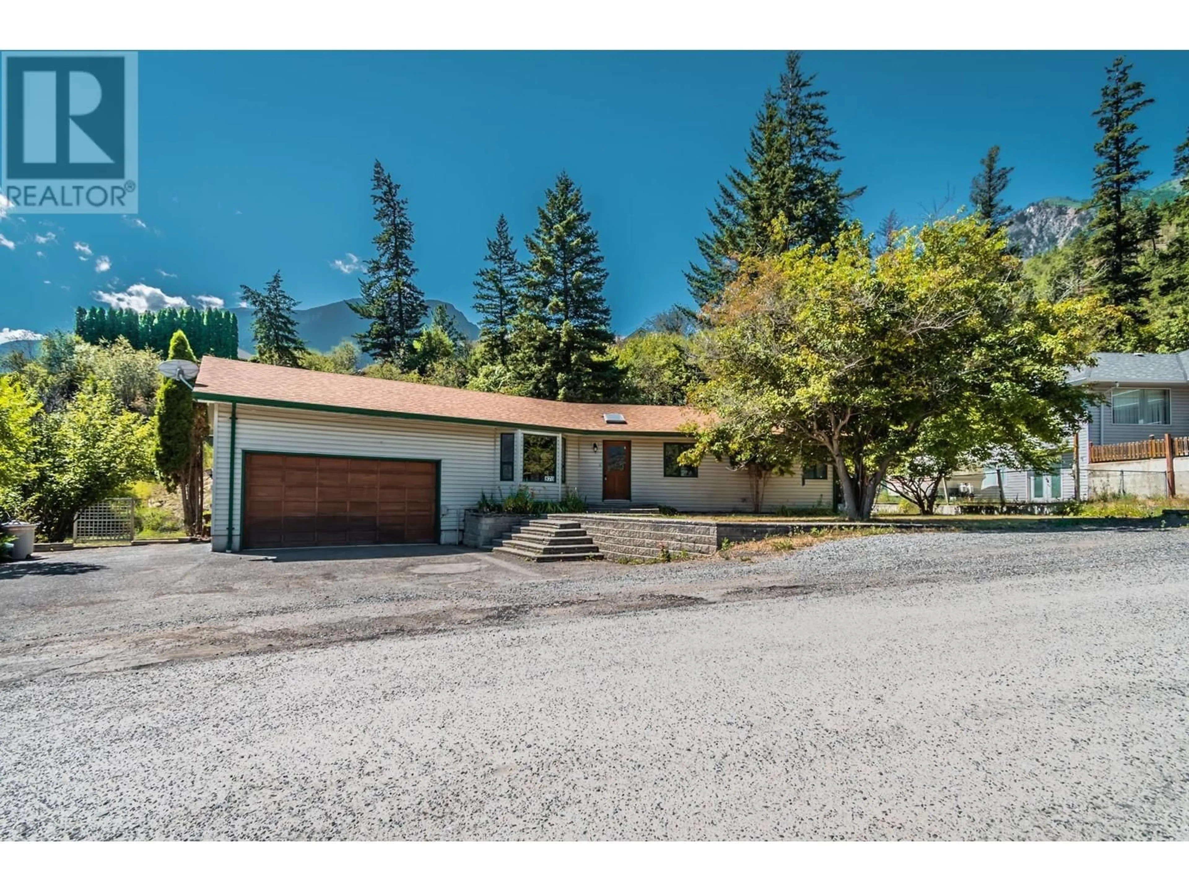 A pic from outside/outdoor area/front of a property/back of a property/a pic from drone, mountain view for 870 EAGLESON CRESCENT, Lillooet British Columbia V0K1V0