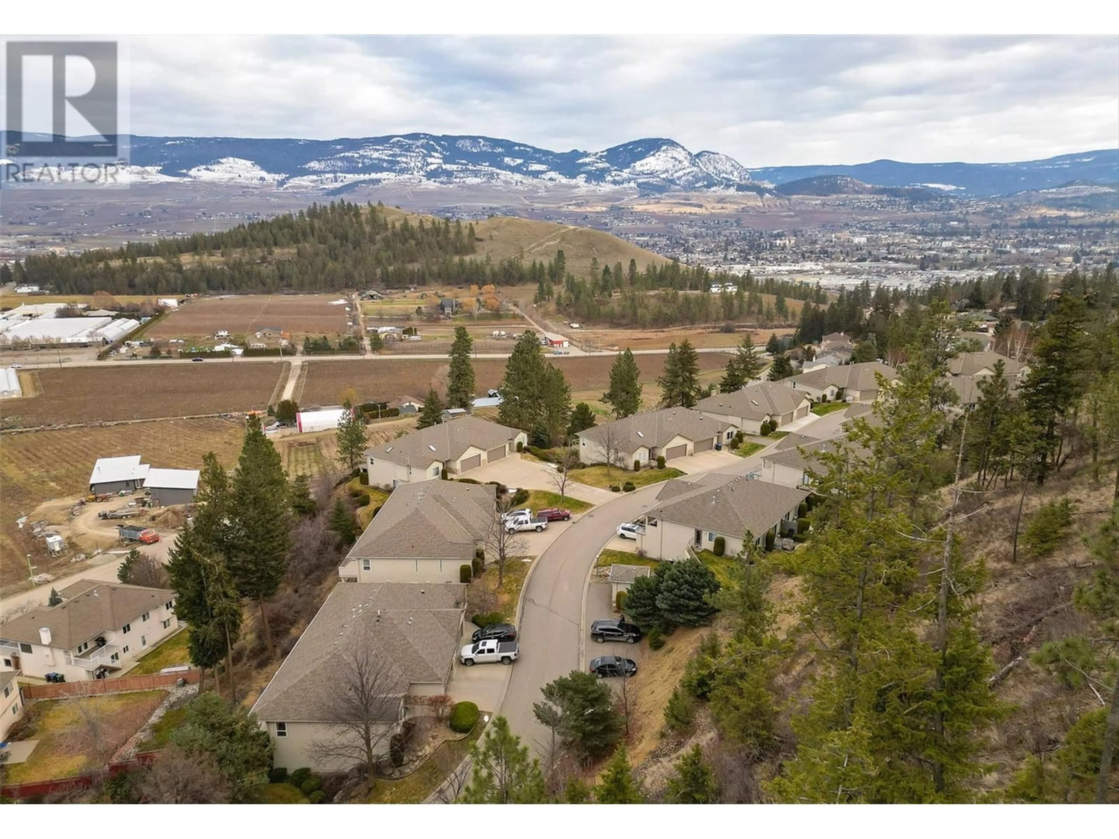 A pic from outside/outdoor area/front of a property/back of a property/a pic from drone, mountain view for 2325 Silver Place Unit# 3, Kelowna British Columbia V1V2L5