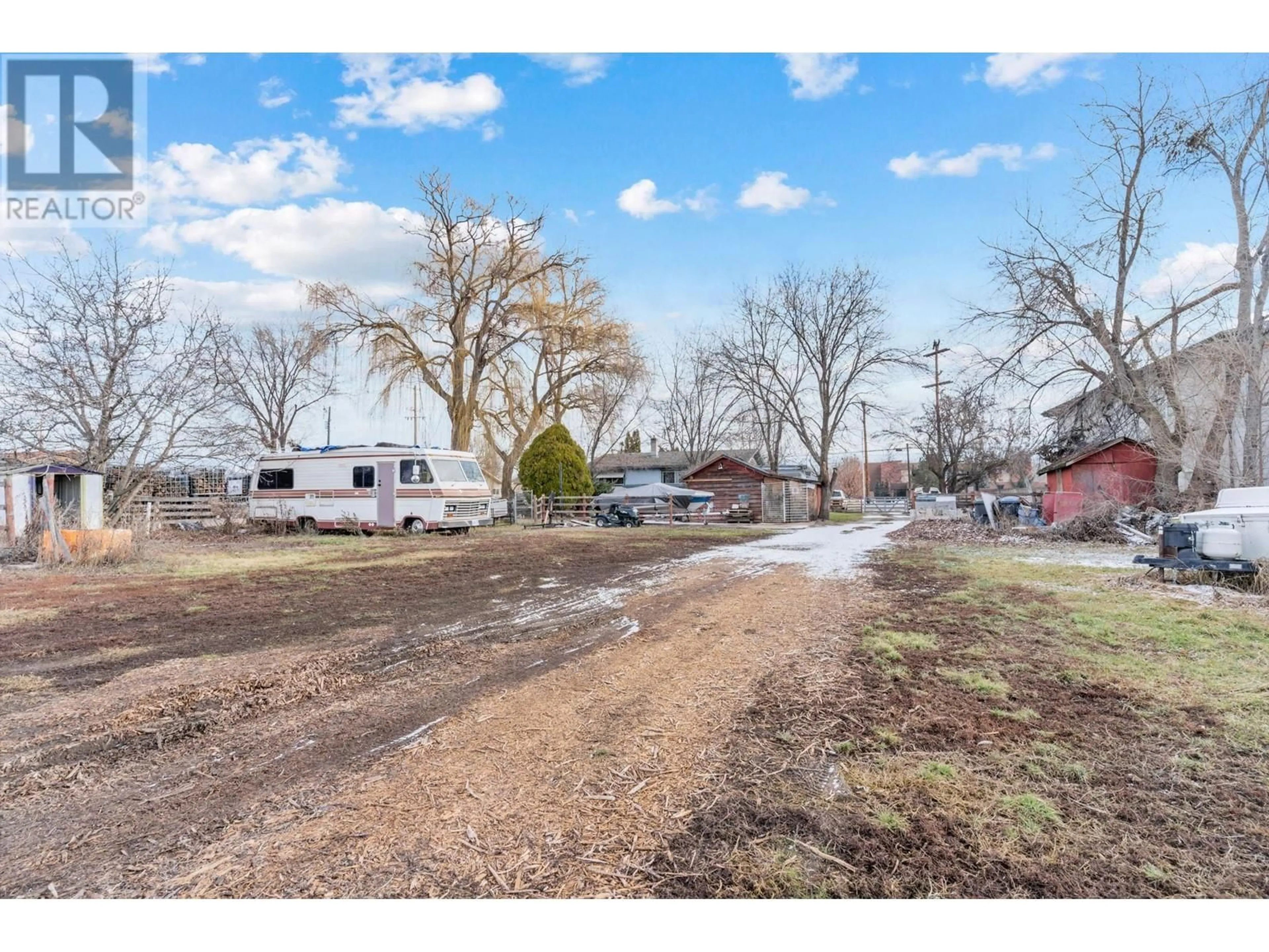 A pic from outside/outdoor area/front of a property/back of a property/a pic from drone, street for 3656 Benvoulin Road, Kelowna British Columbia V1W4M7