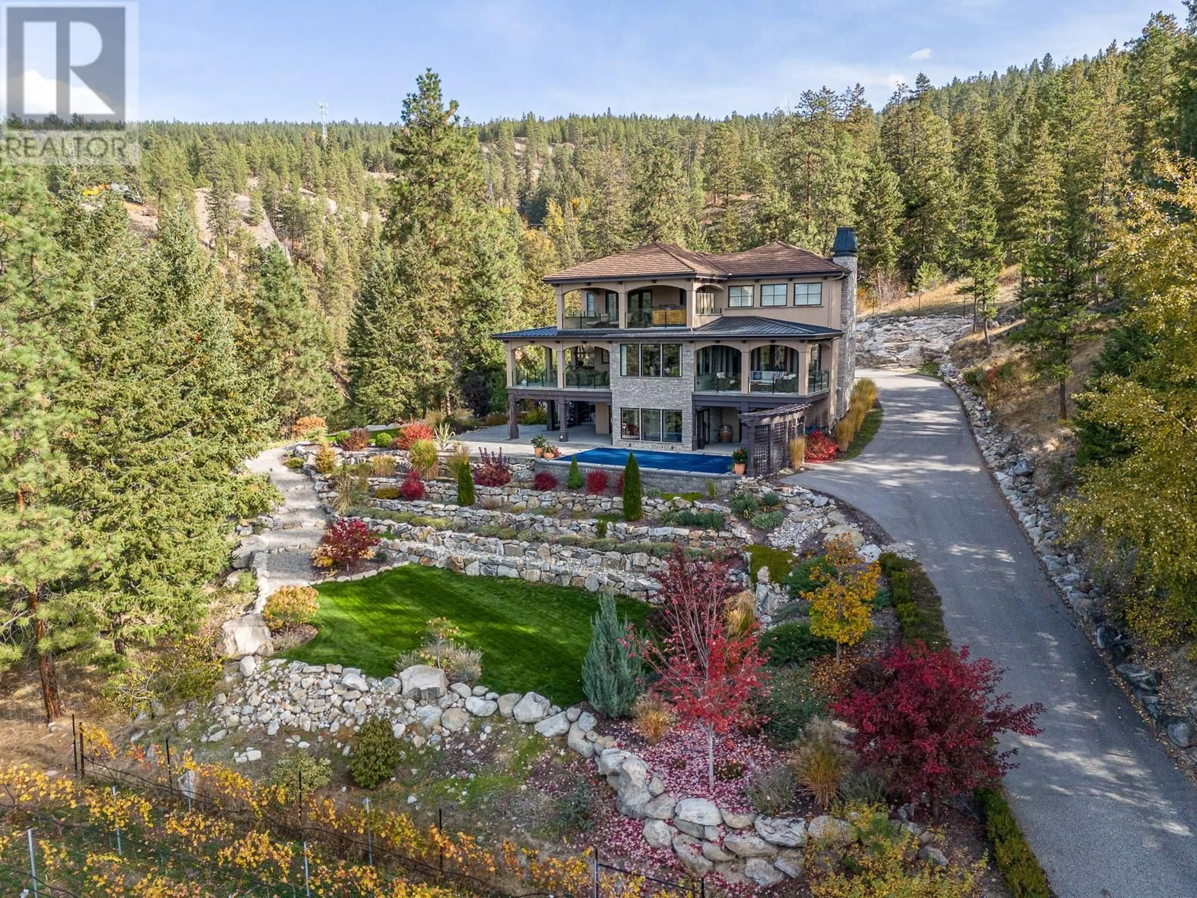 A pic from outside/outdoor area/front of a property/back of a property/a pic from drone, mountain view for 130 SLATE PLACE, Naramata British Columbia V0H1N1