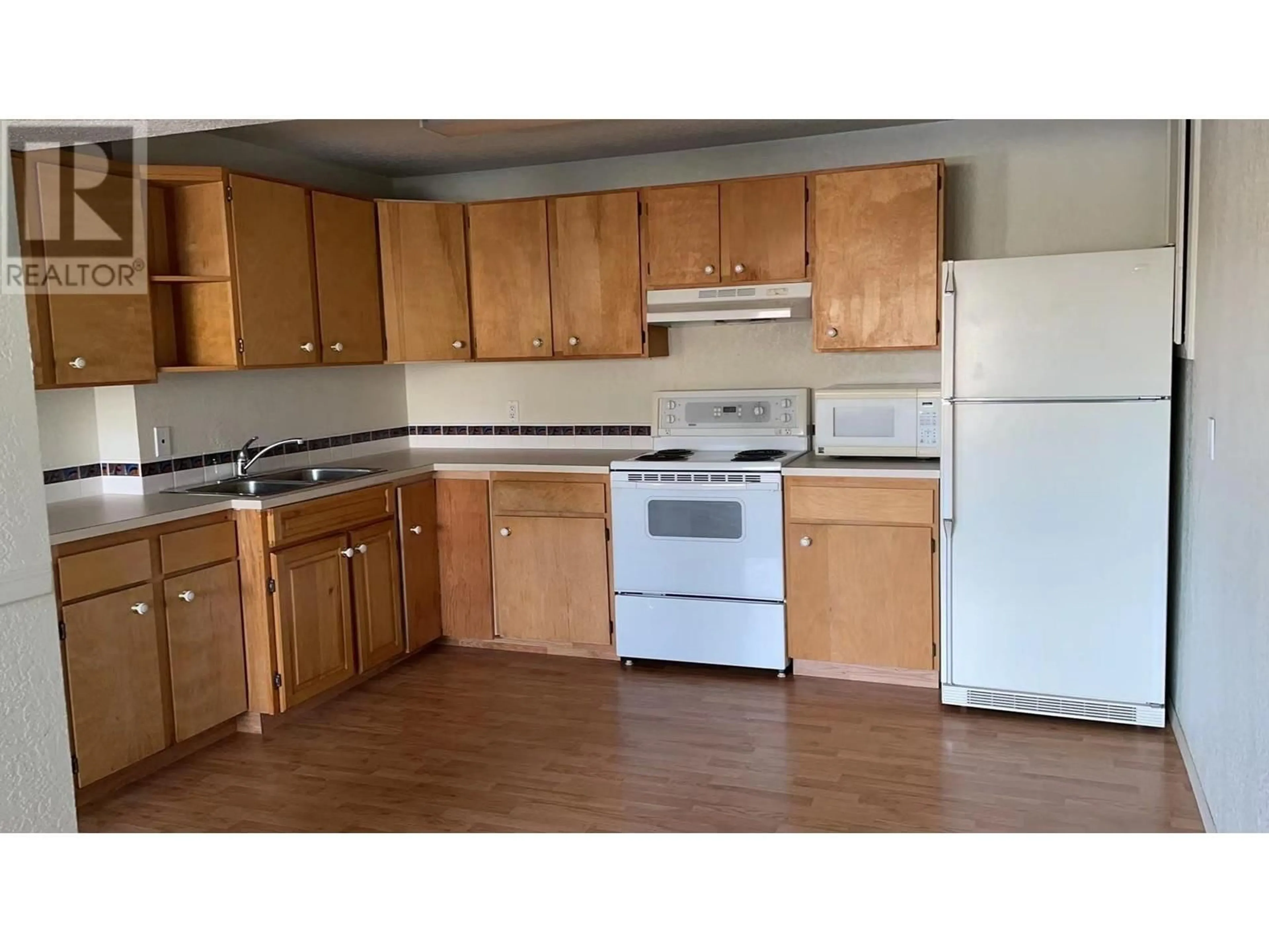 Standard kitchen, wood/laminate floor for 3805 22nd Avenue, Vernon British Columbia V1T1H7