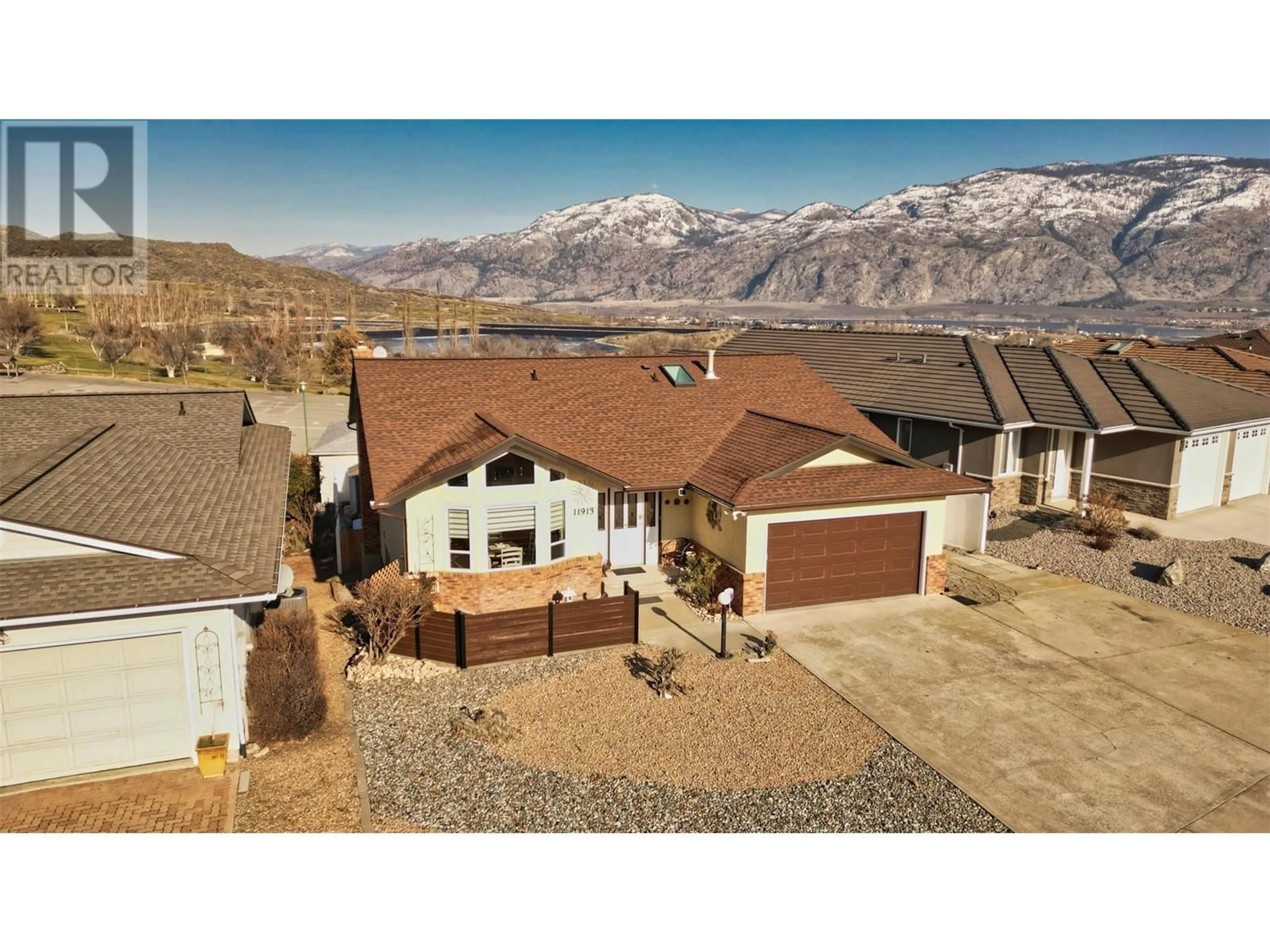 A pic from outside/outdoor area/front of a property/back of a property/a pic from drone, mountain view for 11913 QUAIL RIDGE Place, Osoyoos British Columbia V0H1V4