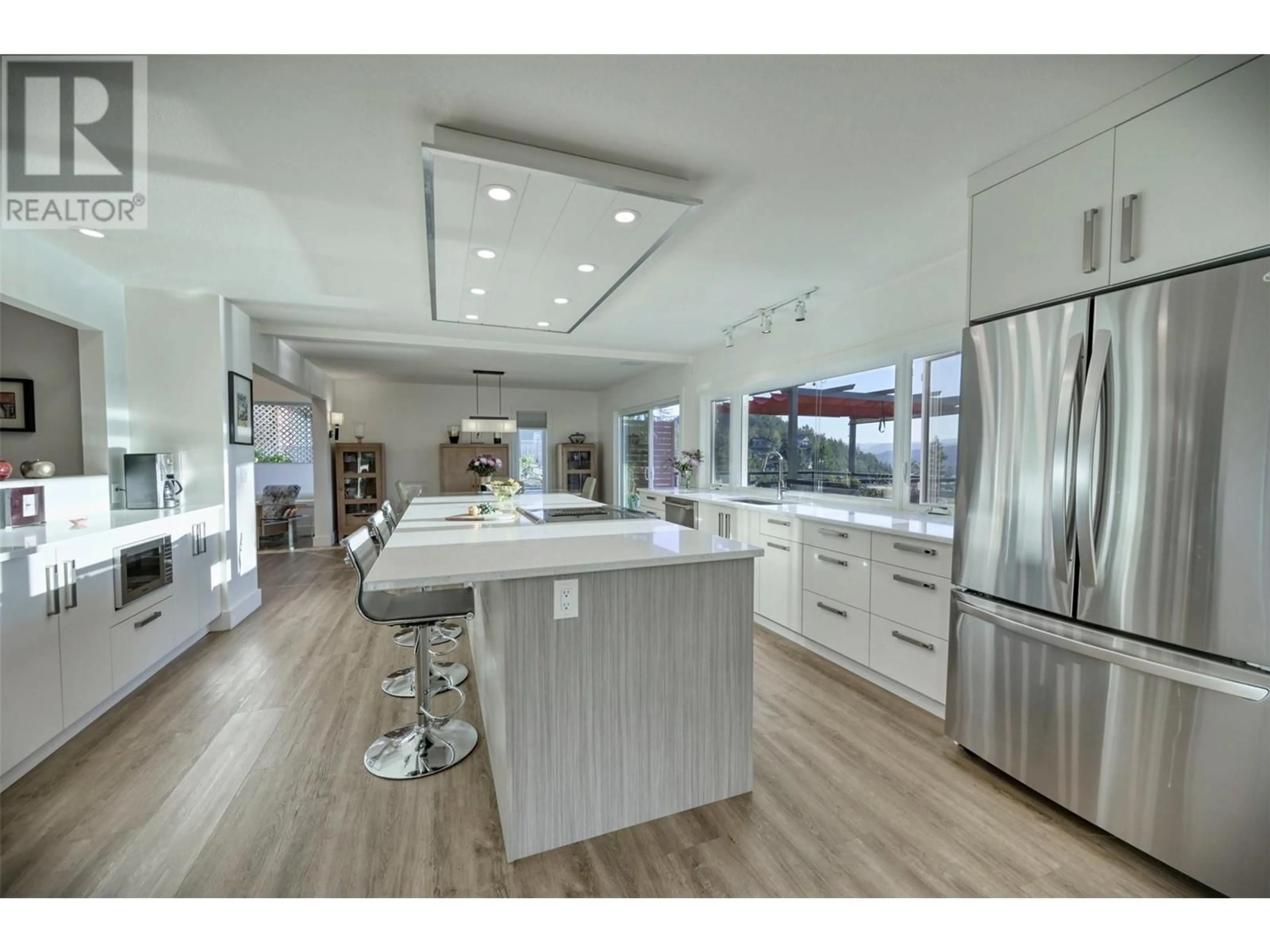 Contemporary kitchen, wood/laminate floor for 150 Boppart Court, Kelowna British Columbia V1V1G4