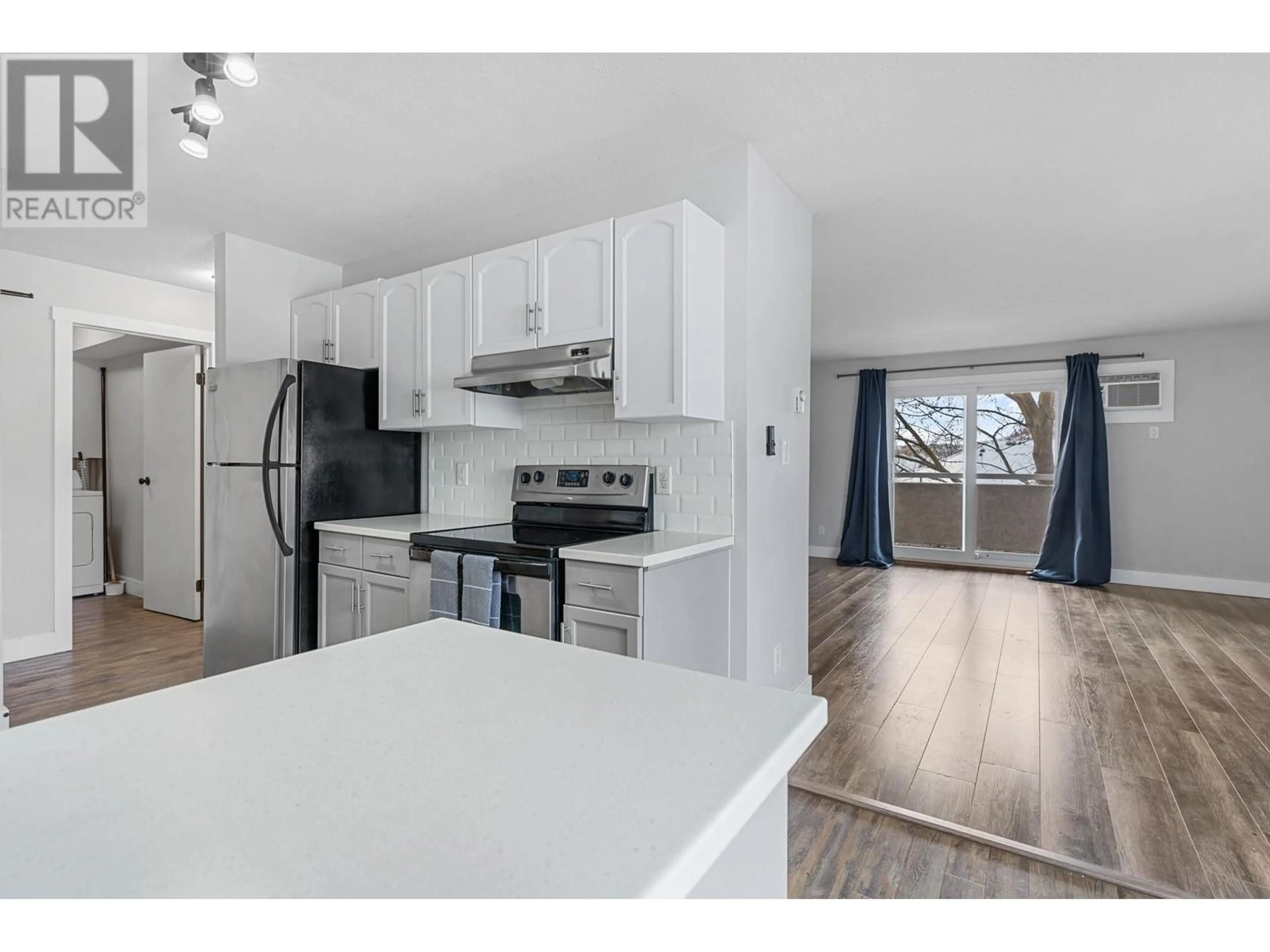 Open concept kitchen, wood/laminate floor for 3854 Gordon Drive Unit# 292 Lot# 172, Kelowna British Columbia V1W3G5