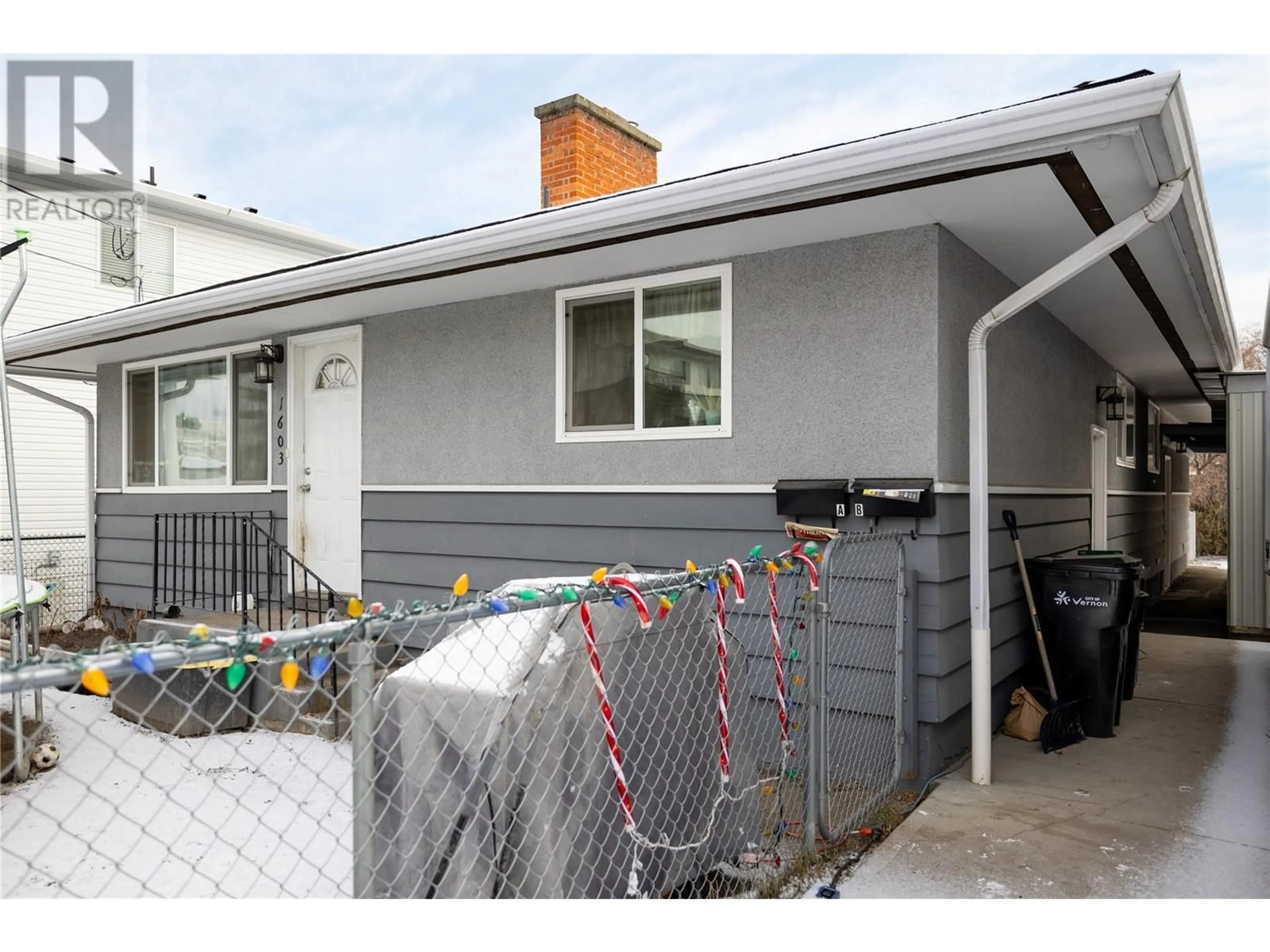 Home with vinyl exterior material, street for 1603 A 31 Street, Vernon British Columbia V1T5T7