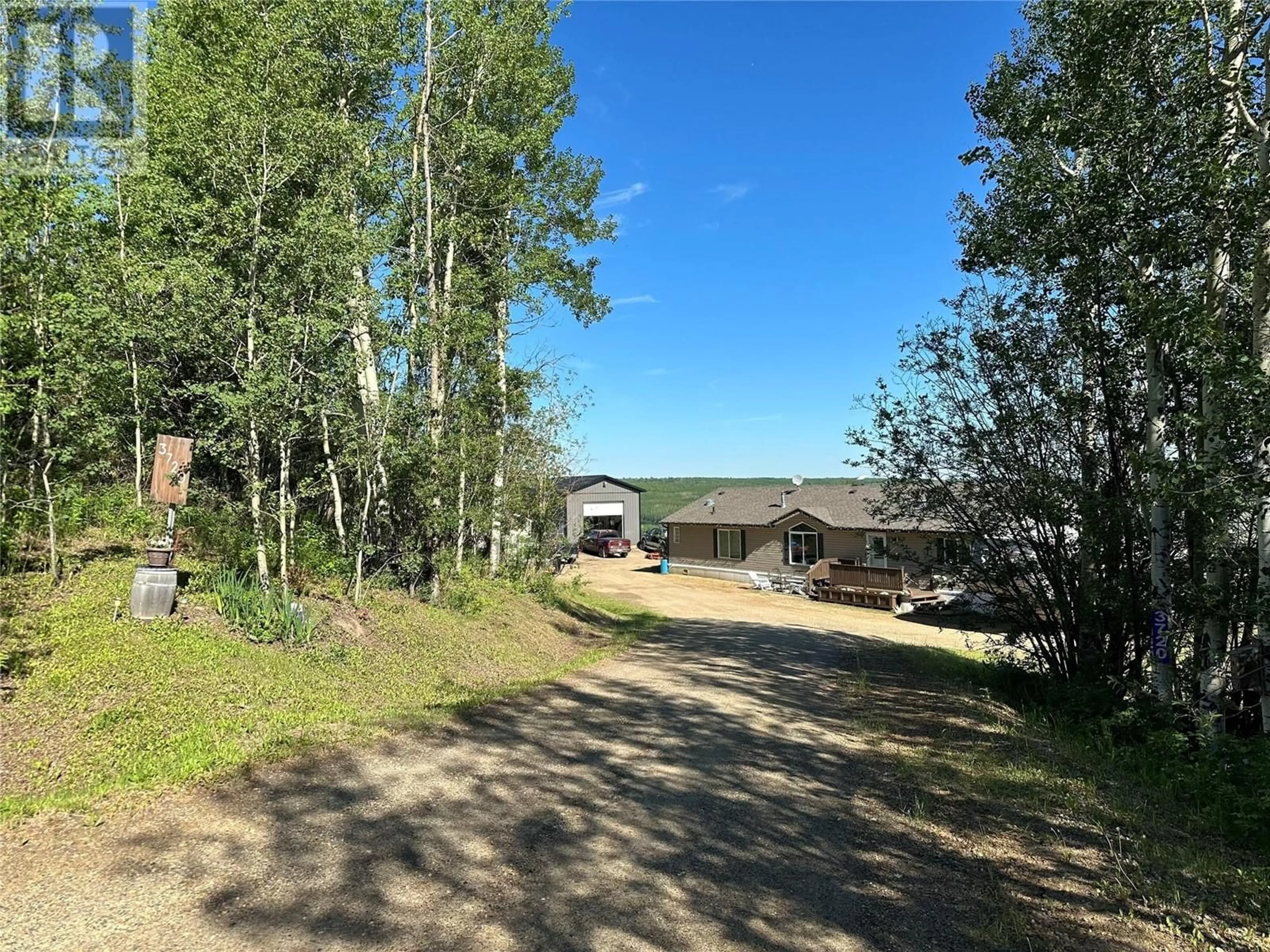 A pic from outside/outdoor area/front of a property/back of a property/a pic from drone, forest/trees view for 3720 206 Road, Dawson Creek British Columbia V1G0C2