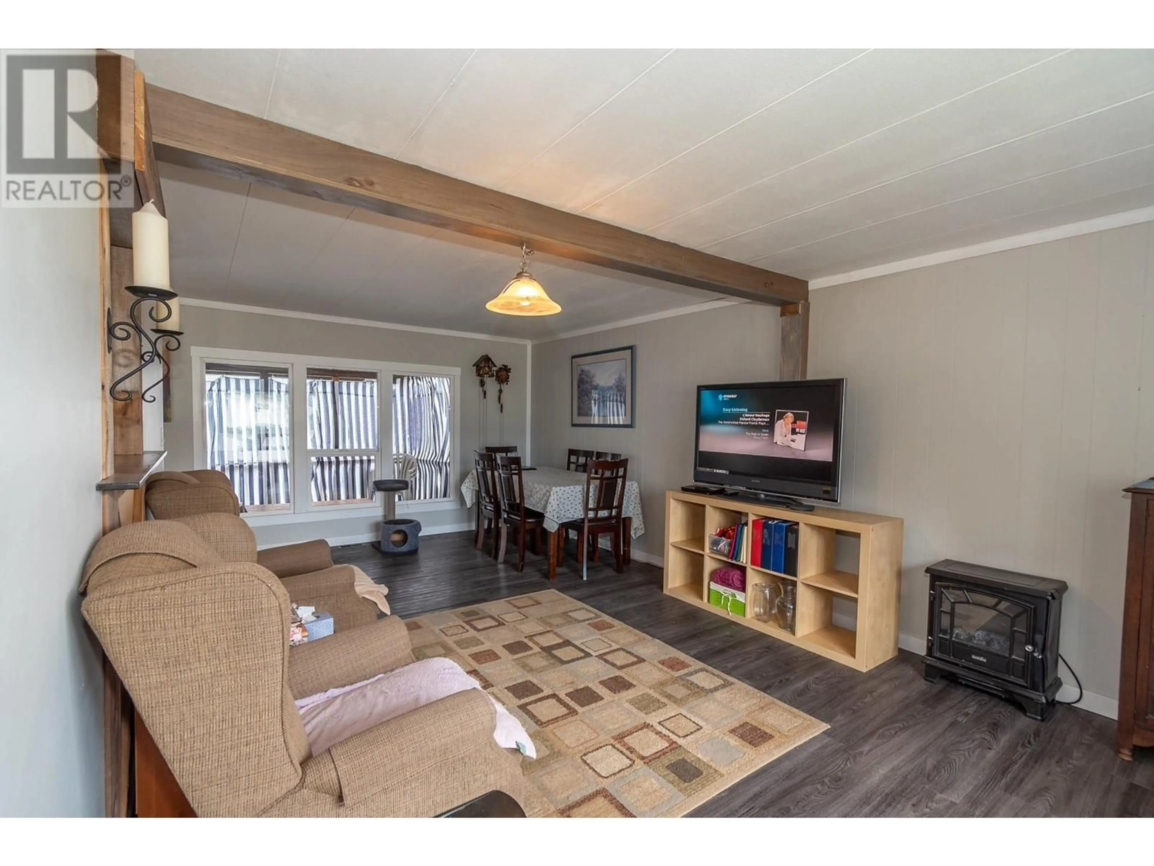 Living room with furniture, wood/laminate floor for 1361 30 Street SE Unit# 84, Salmon Arm British Columbia V1E2N4