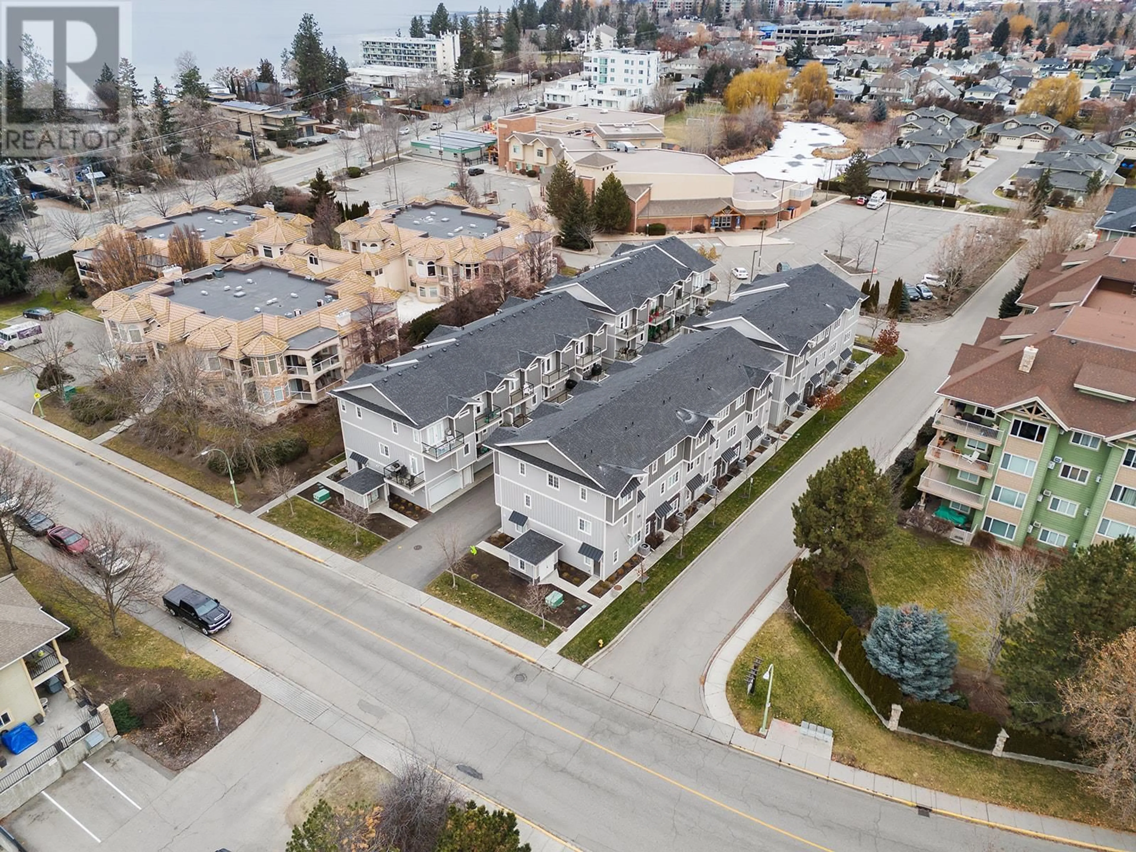 A pic from outside/outdoor area/front of a property/back of a property/a pic from drone, street for 644 Lequime Road Unit# 15, Kelowna British Columbia V1W1A4