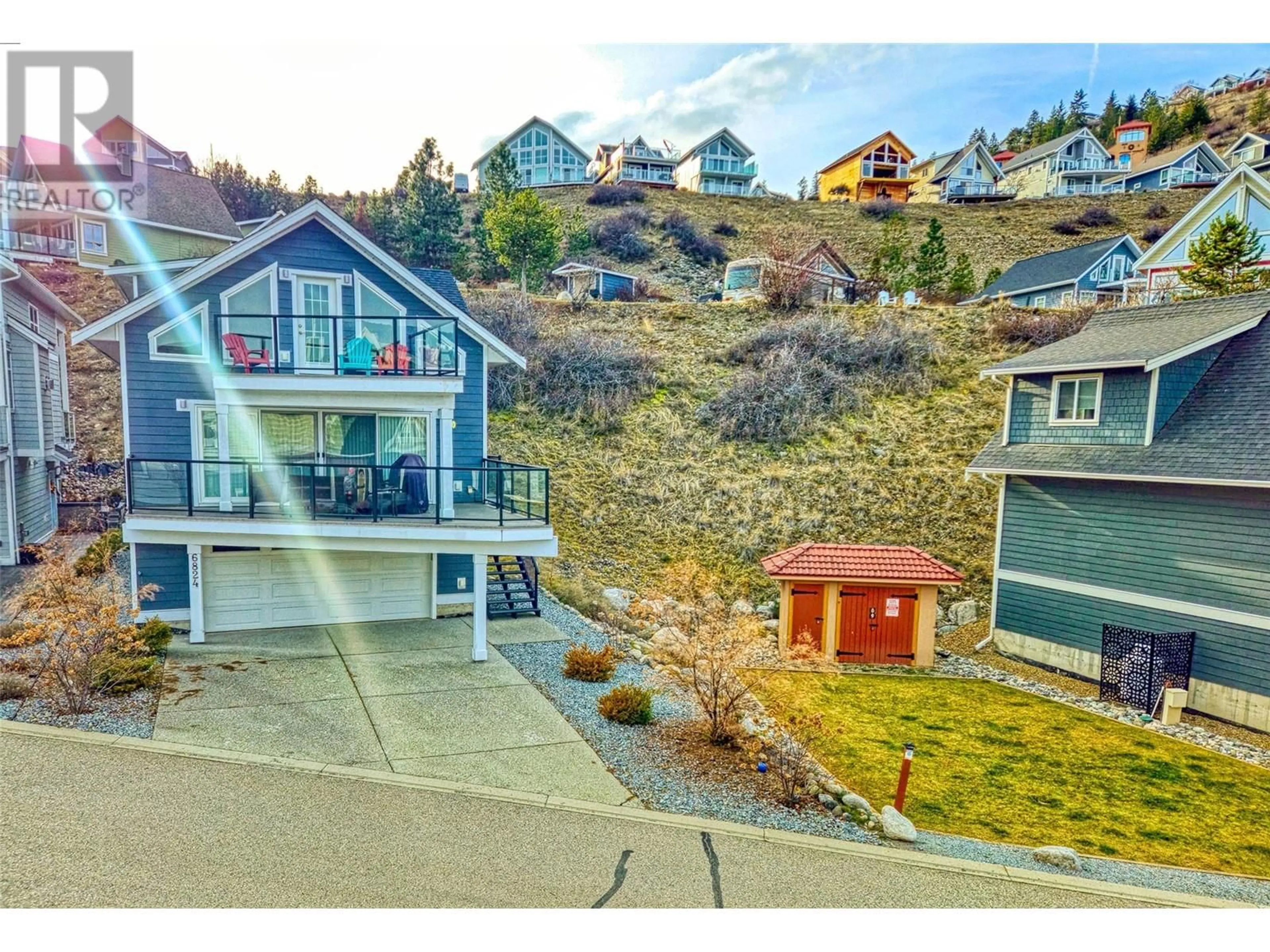 A pic from outside/outdoor area/front of a property/back of a property/a pic from drone, mountain view for 168 - 6824 SANTIAGO LOOP, Kelowna British Columbia V1Z3R8