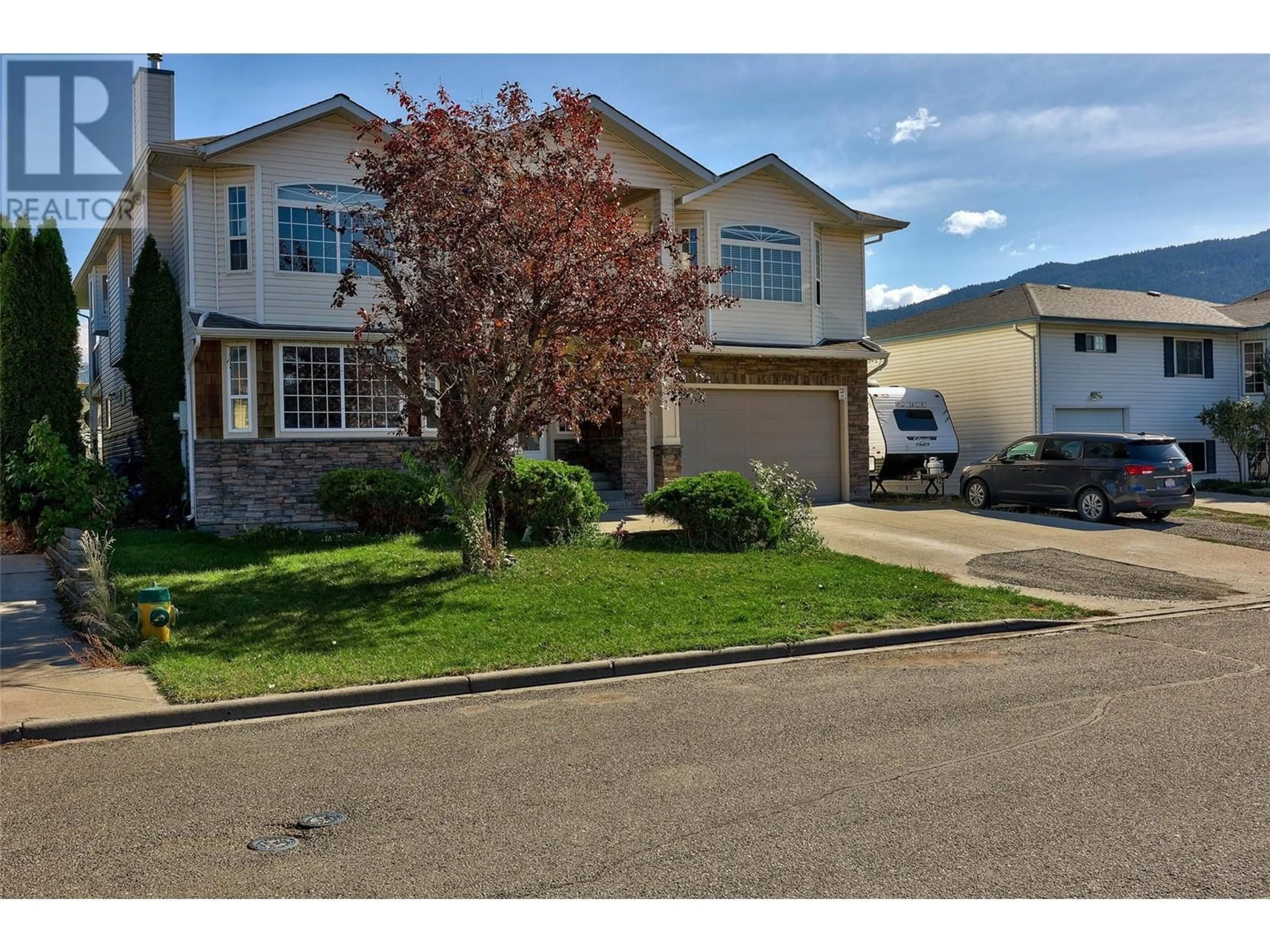 Home with vinyl exterior material, street for 1690 BANN STREET, Merritt British Columbia V1K1E9