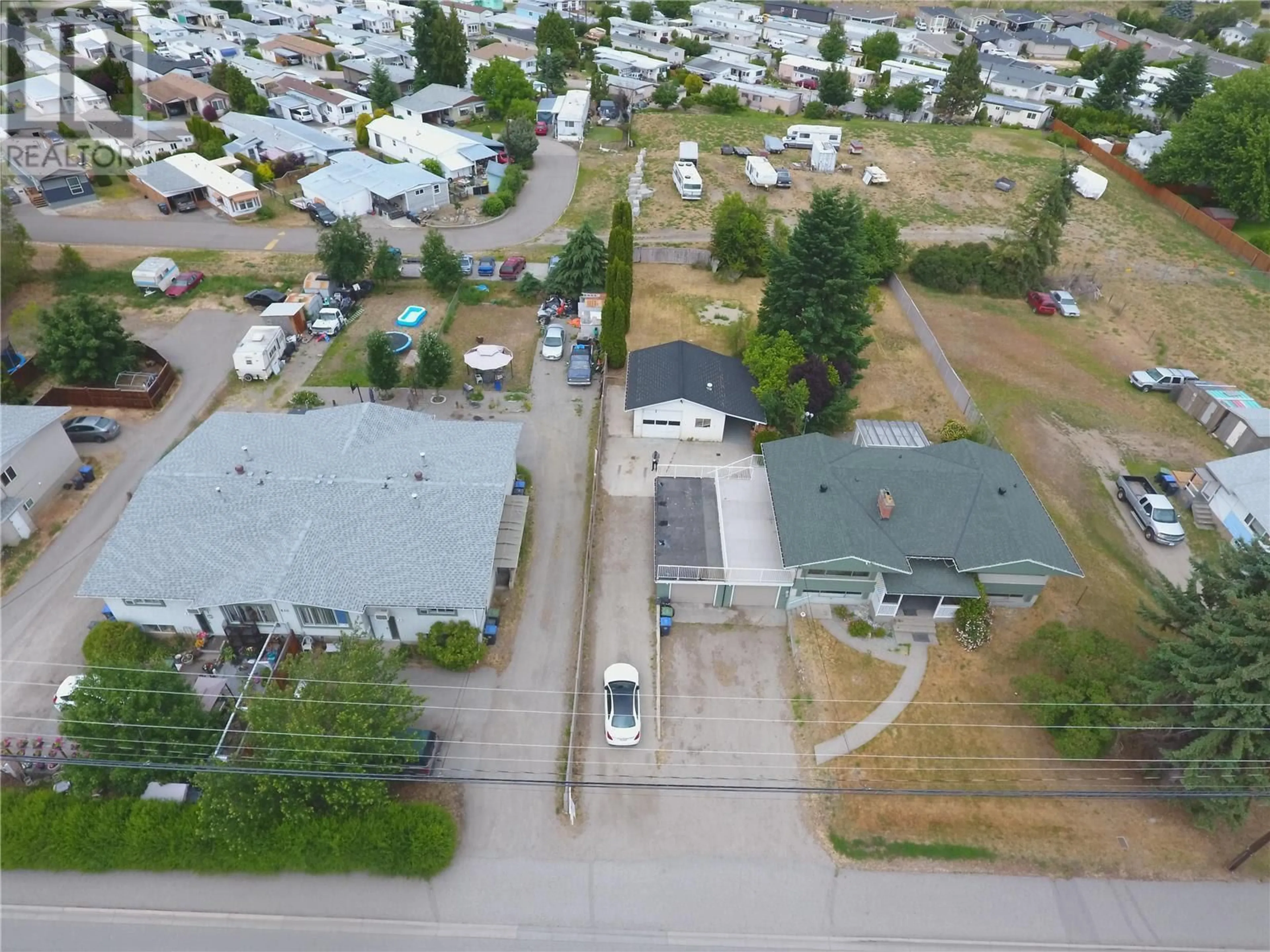 A pic from outside/outdoor area/front of a property/back of a property/a pic from drone, street for 510-530 MCCURDY ROAD, Kelowna British Columbia V1X2P5