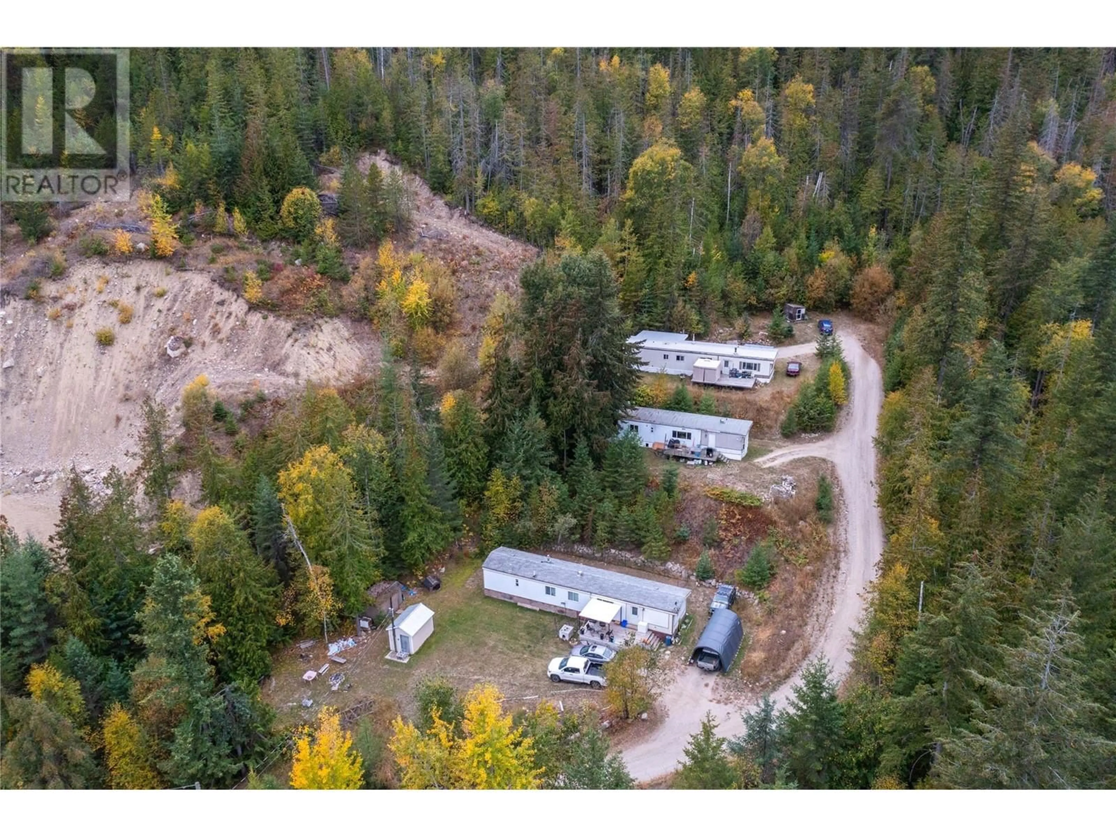 A pic from outside/outdoor area/front of a property/back of a property/a pic from drone, forest/trees view for 1,2,3 - 649 LEE ROAD, Tappen British Columbia V0E2X0