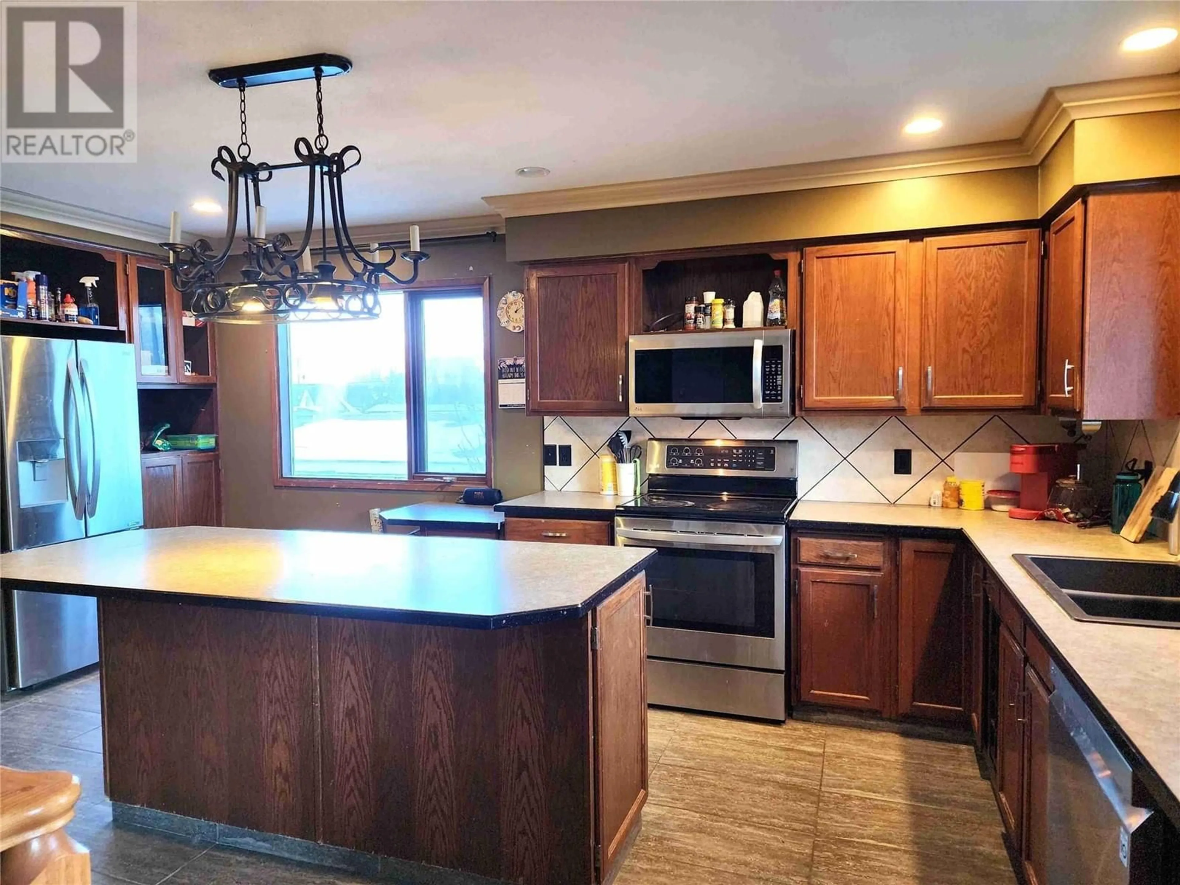 Open concept kitchen, unknown for 1408 Spruce Avenue, Merritt British Columbia V1K1L2