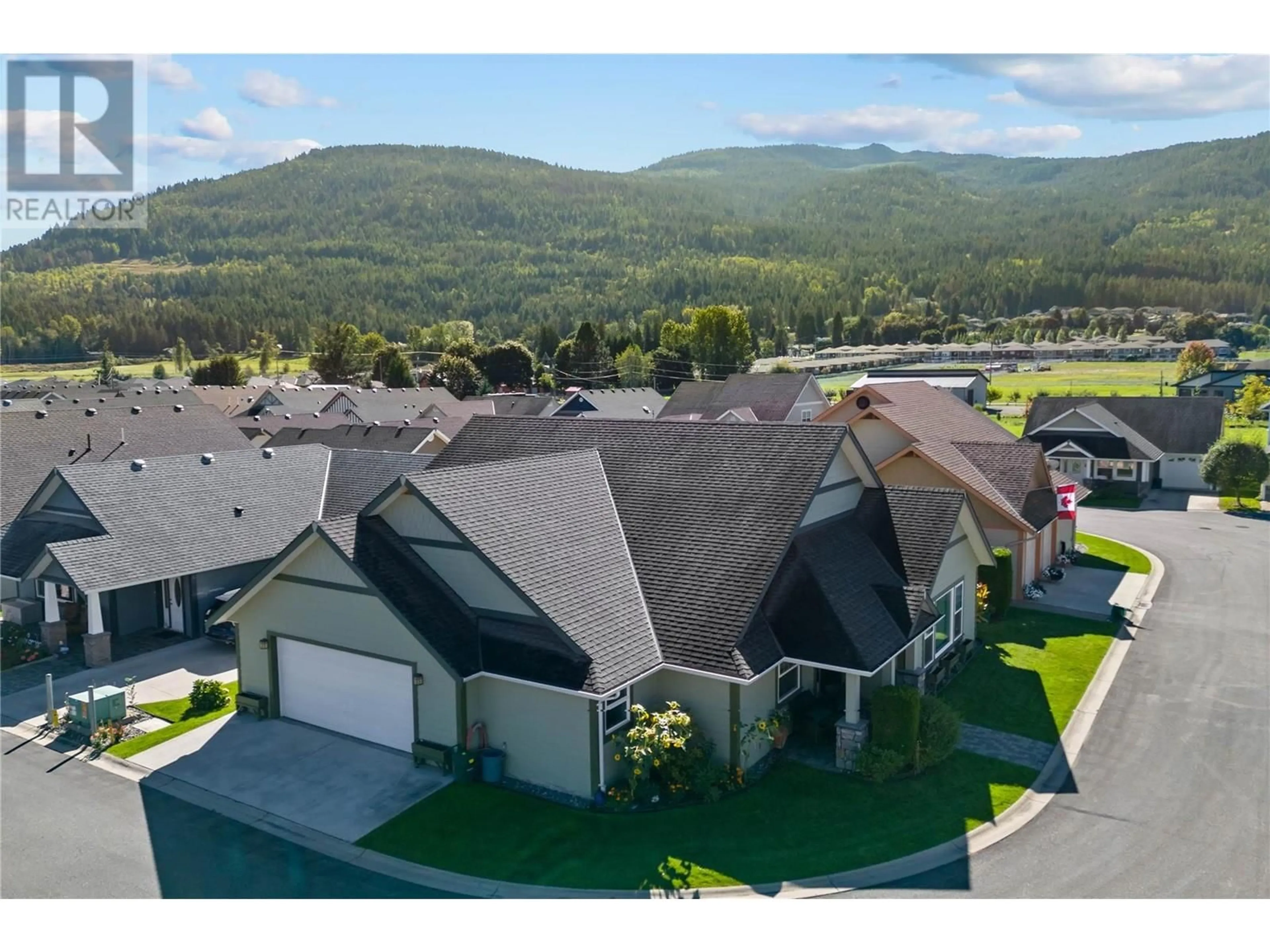 A pic from outside/outdoor area/front of a property/back of a property/a pic from drone, mountain view for 38 - 1231 10 STREET SOUTHWEST, Salmon Arm British Columbia V1E0A5