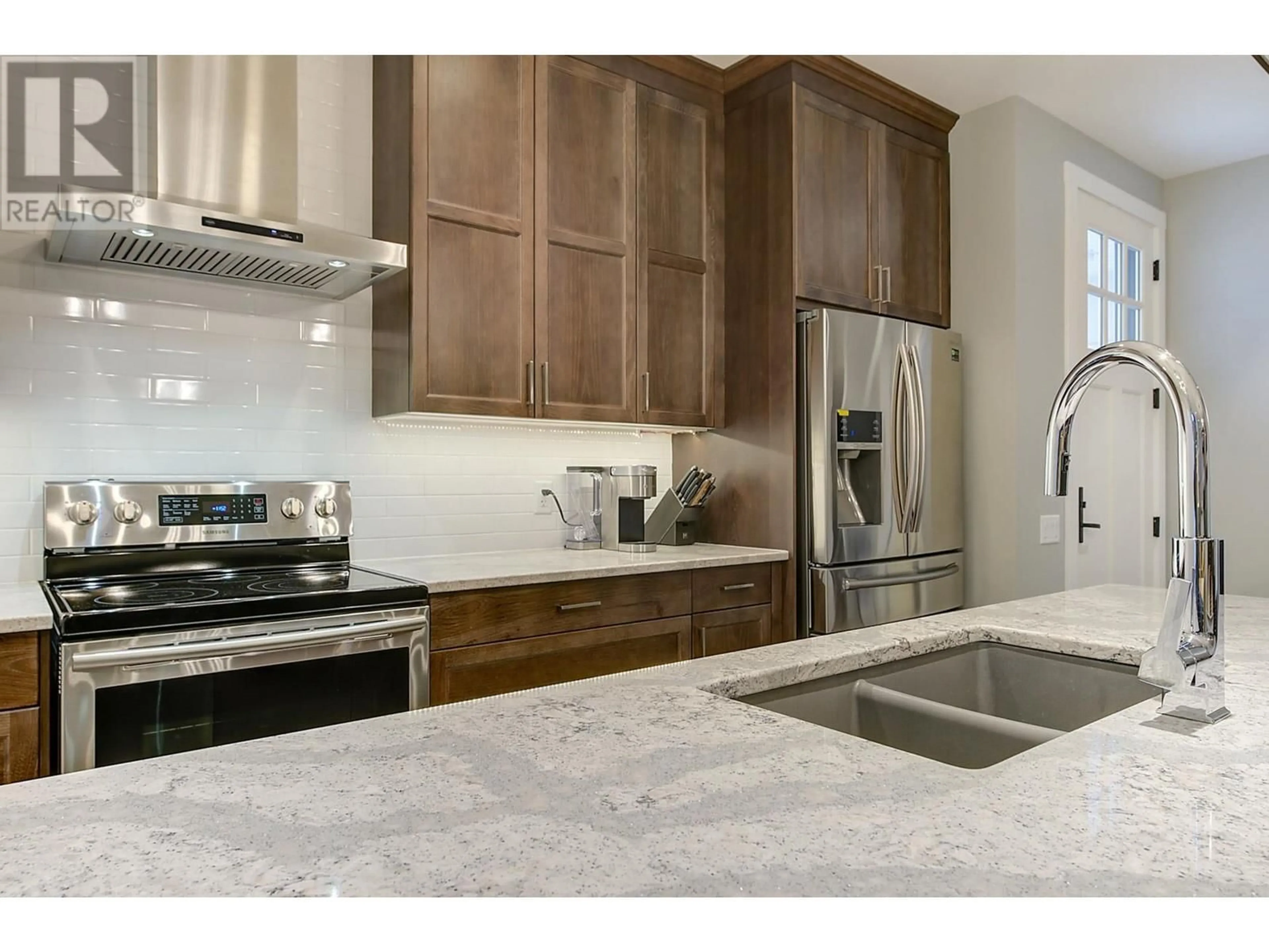 Contemporary kitchen, ceramic/tile floor for 1940 KLO Road Unit# 7, Kelowna British Columbia V1W2H6