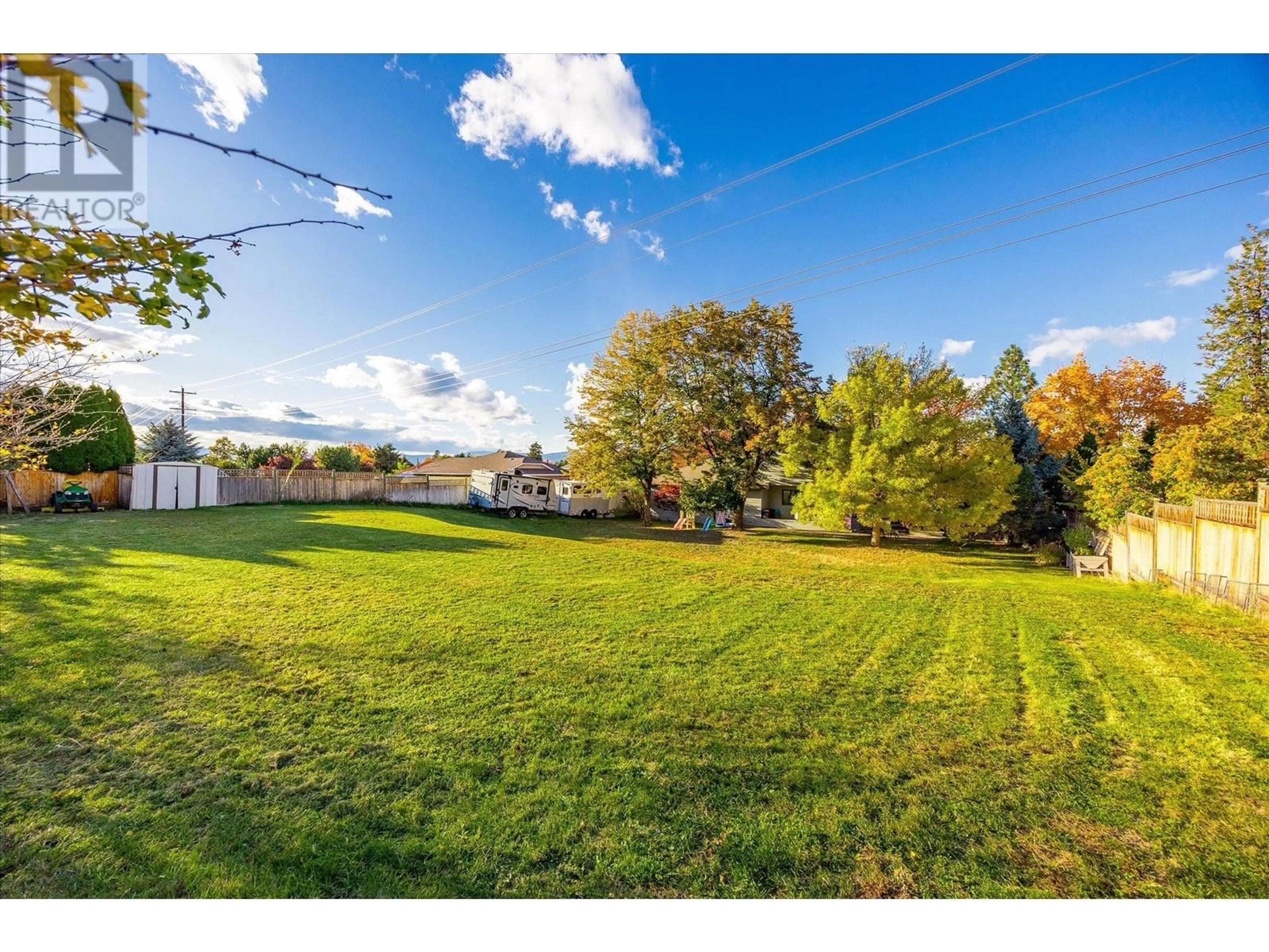 A pic from outside/outdoor area/front of a property/back of a property/a pic from drone, water/lake/river/ocean view for 1523 Sunridge Court, Kelowna British Columbia V1W2Z9