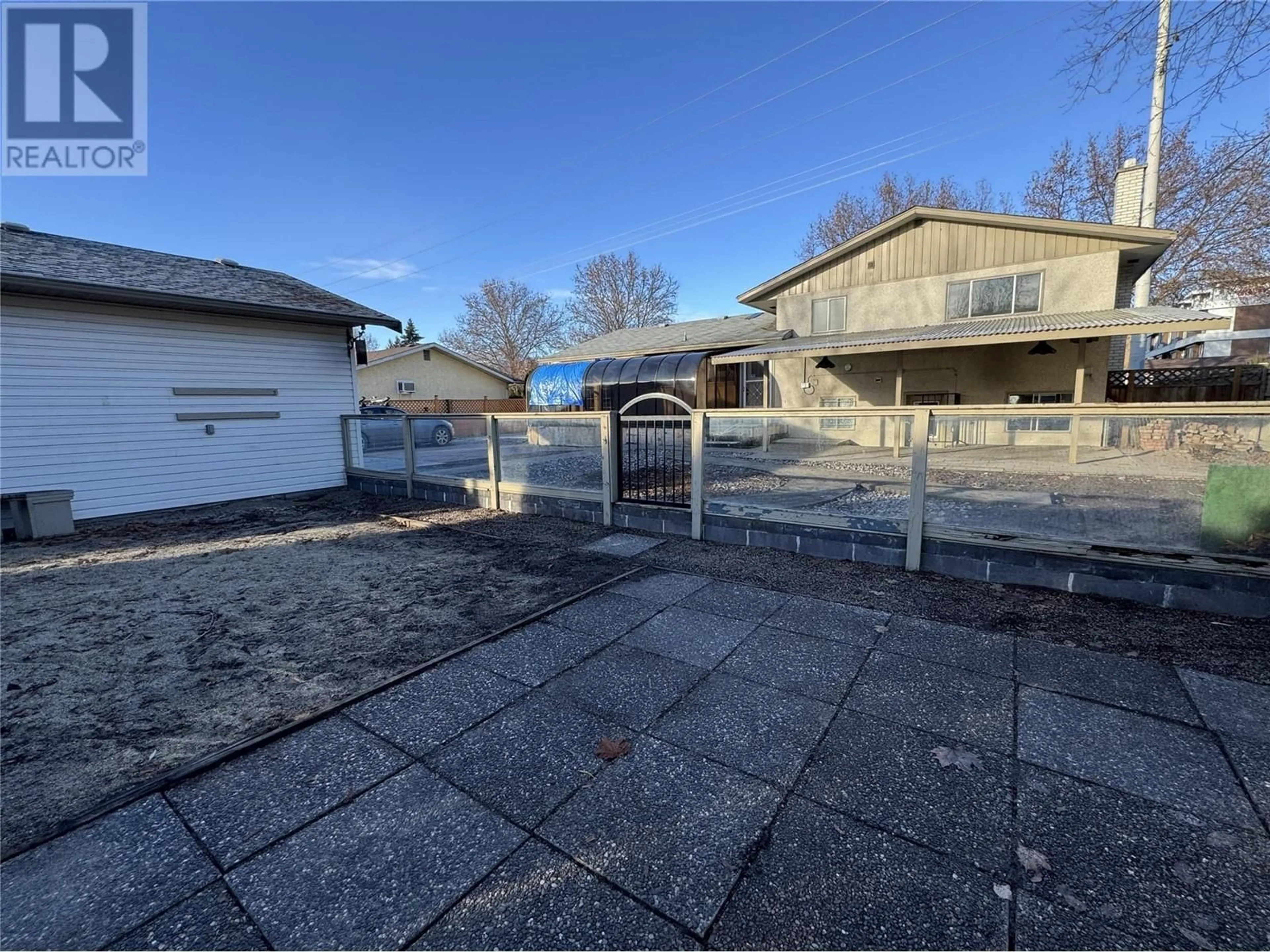 A pic from outside/outdoor area/front of a property/back of a property/a pic from drone, street for 1441 Springfield Road, Kelowna British Columbia V1Y5V2