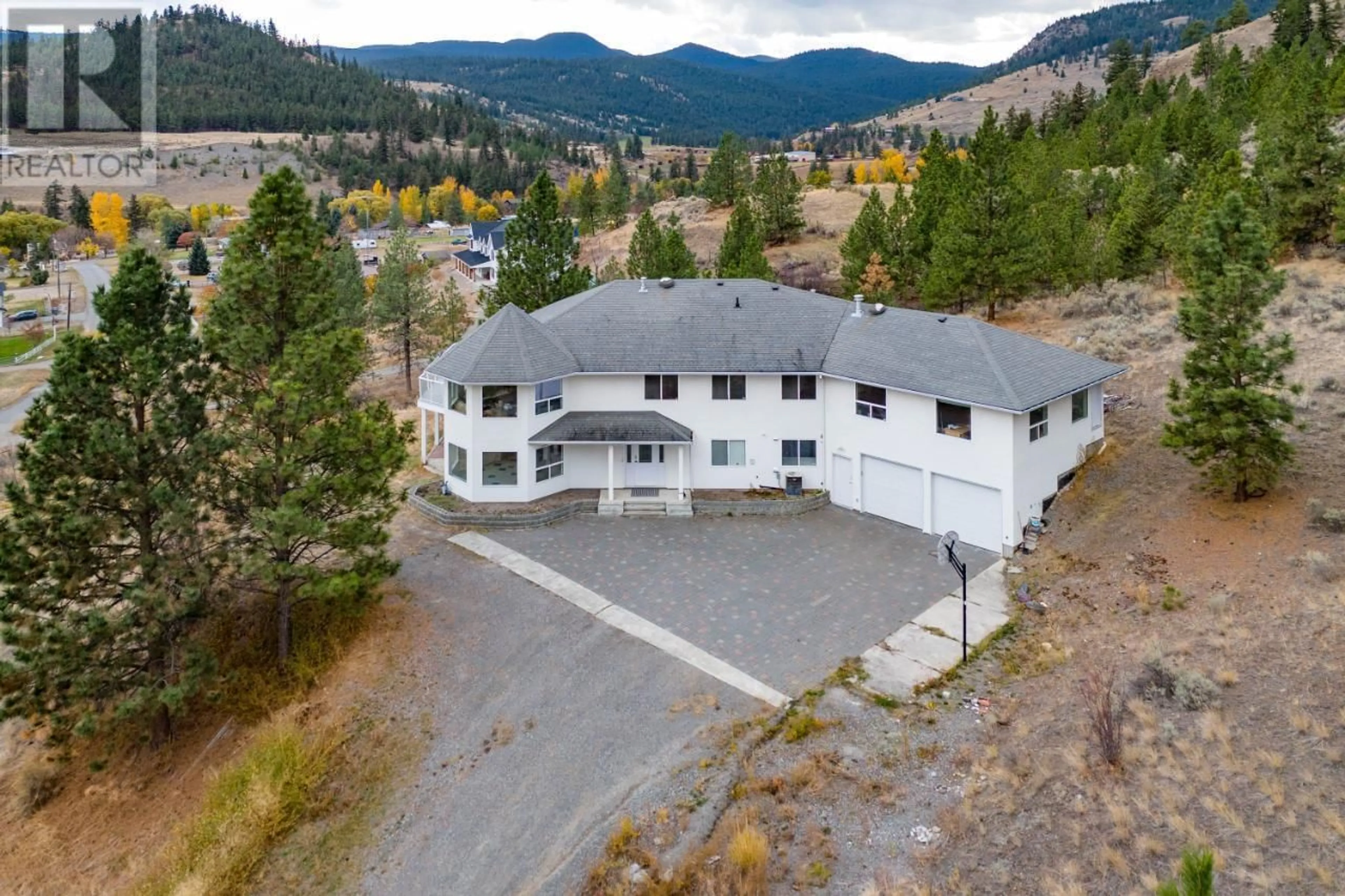 A pic from outside/outdoor area/front of a property/back of a property/a pic from drone, mountain view for 7035 BLACKWELL Road, Kamloops British Columbia V2H1T7