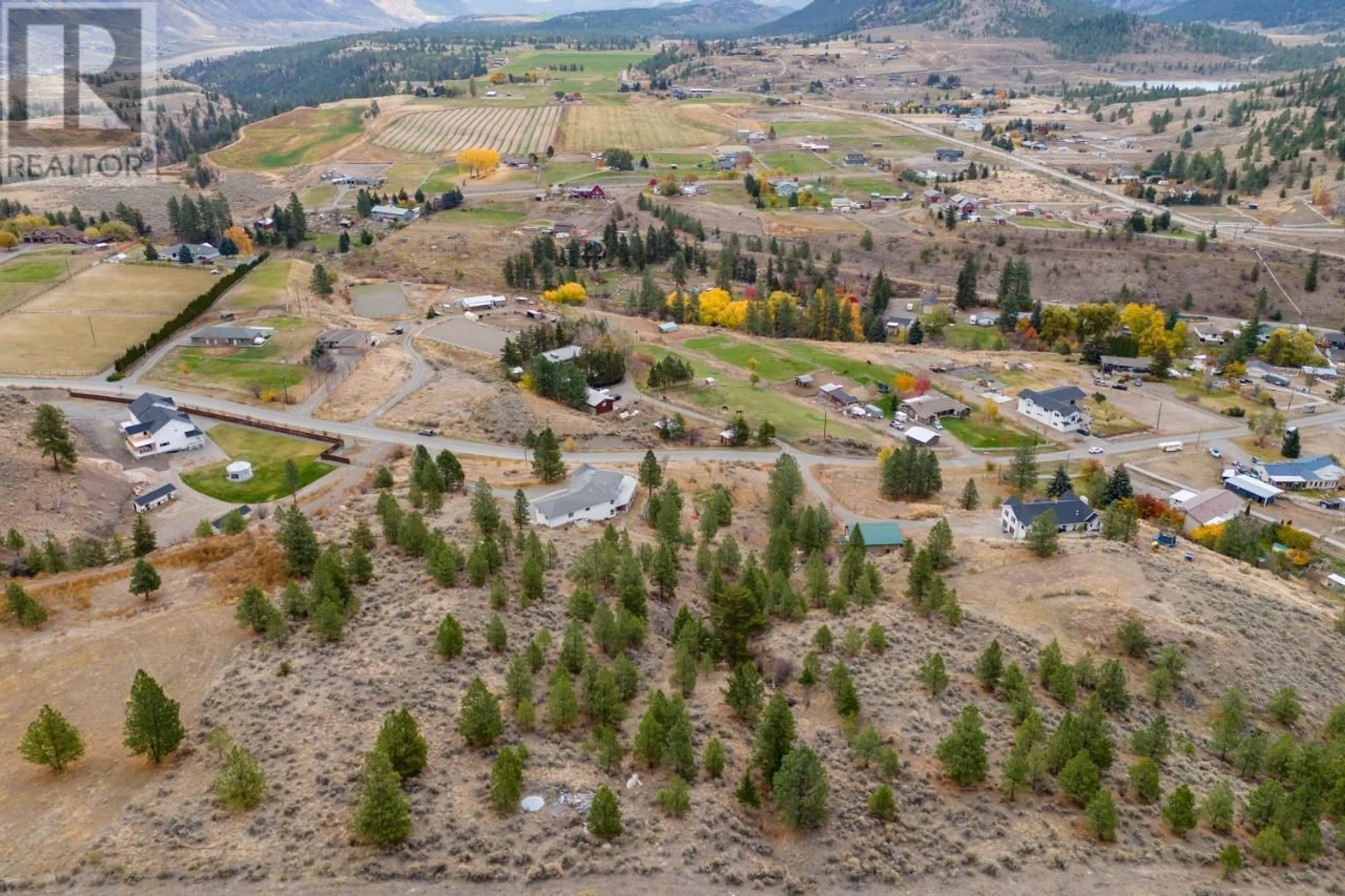 A pic from outside/outdoor area/front of a property/back of a property/a pic from drone, mountain view for 7035 BLACKWELL Road, Kamloops British Columbia V2H1T7