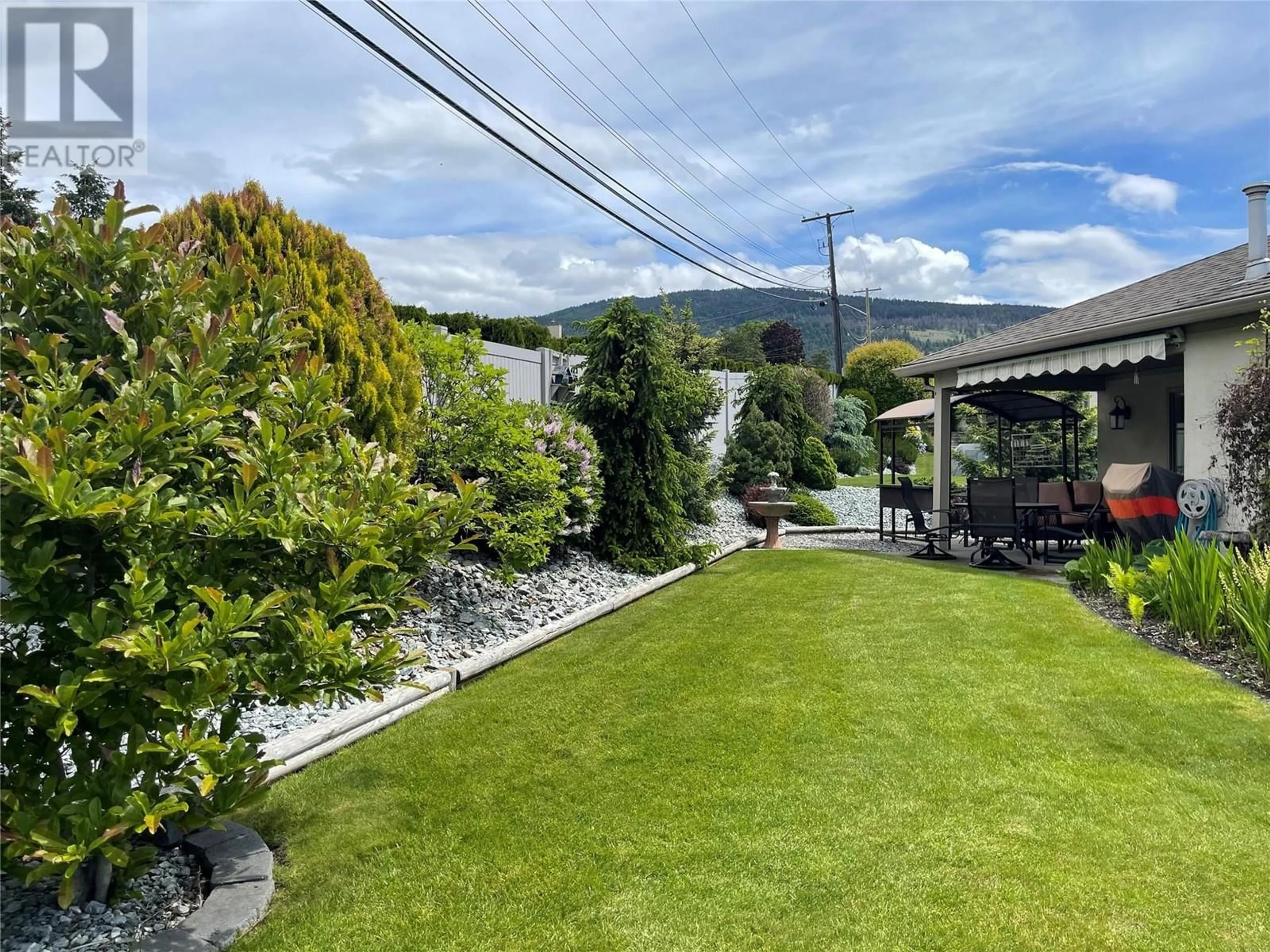 A pic from outside/outdoor area/front of a property/back of a property/a pic from drone, mountain view for 1220 25 Avenue Unit# 3, Vernon British Columbia V1T9A1