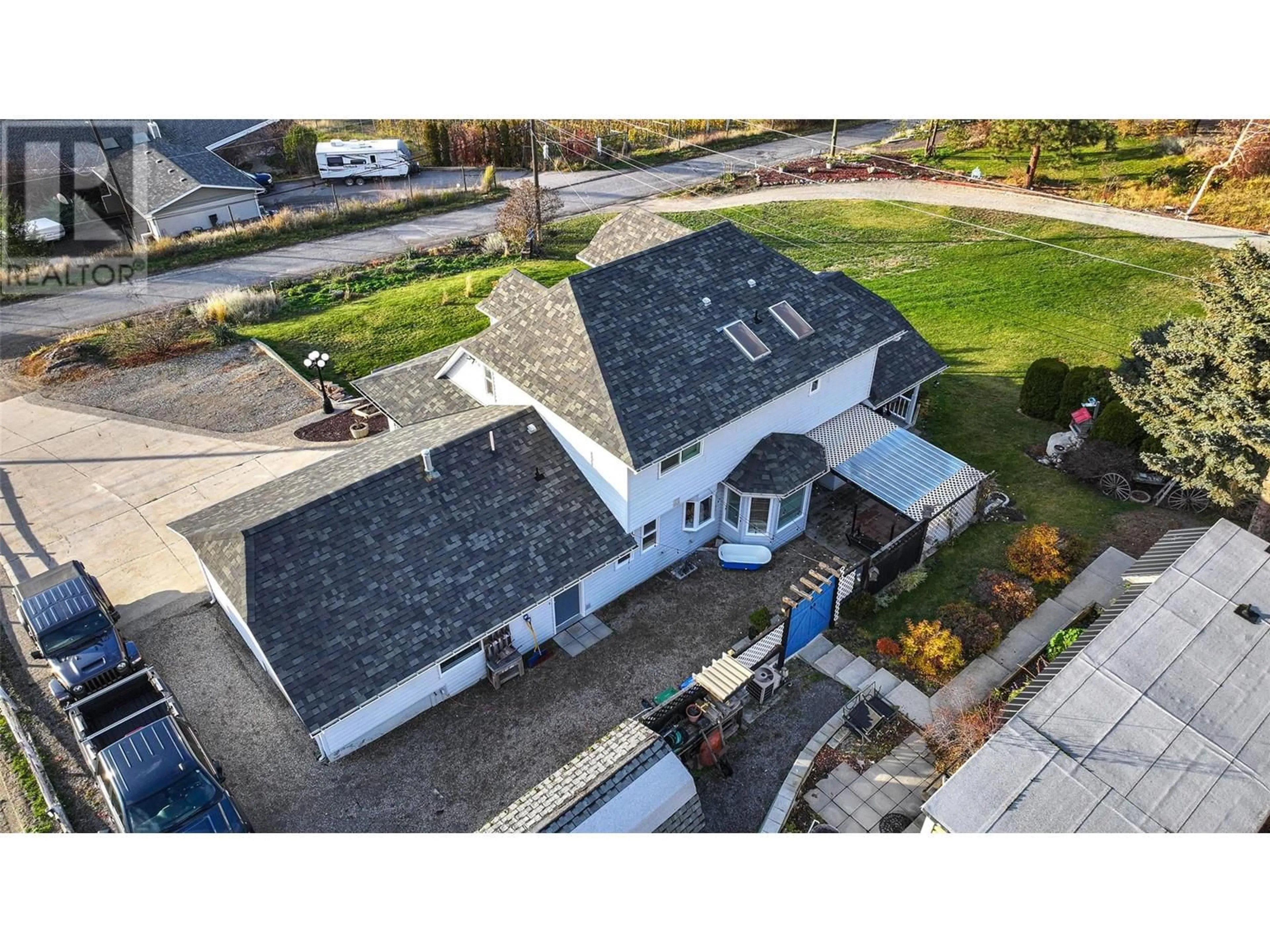 A pic from outside/outdoor area/front of a property/back of a property/a pic from drone, street for 13071 Trewhitt Road E, Lake Country British Columbia V4V2B1