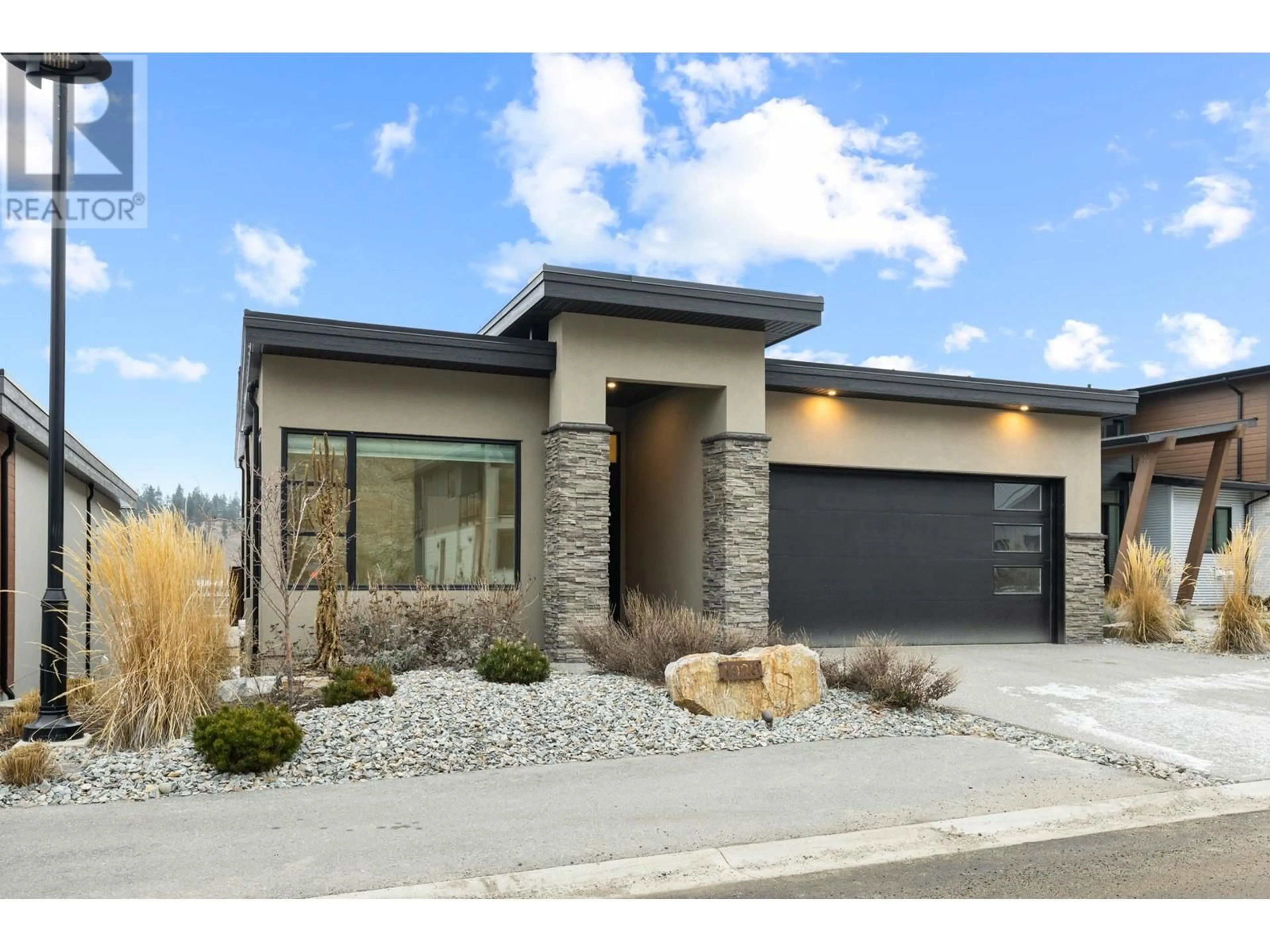 Home with brick exterior material, street for 1928 Northern Flicker Court, Kelowna British Columbia V1V0G3