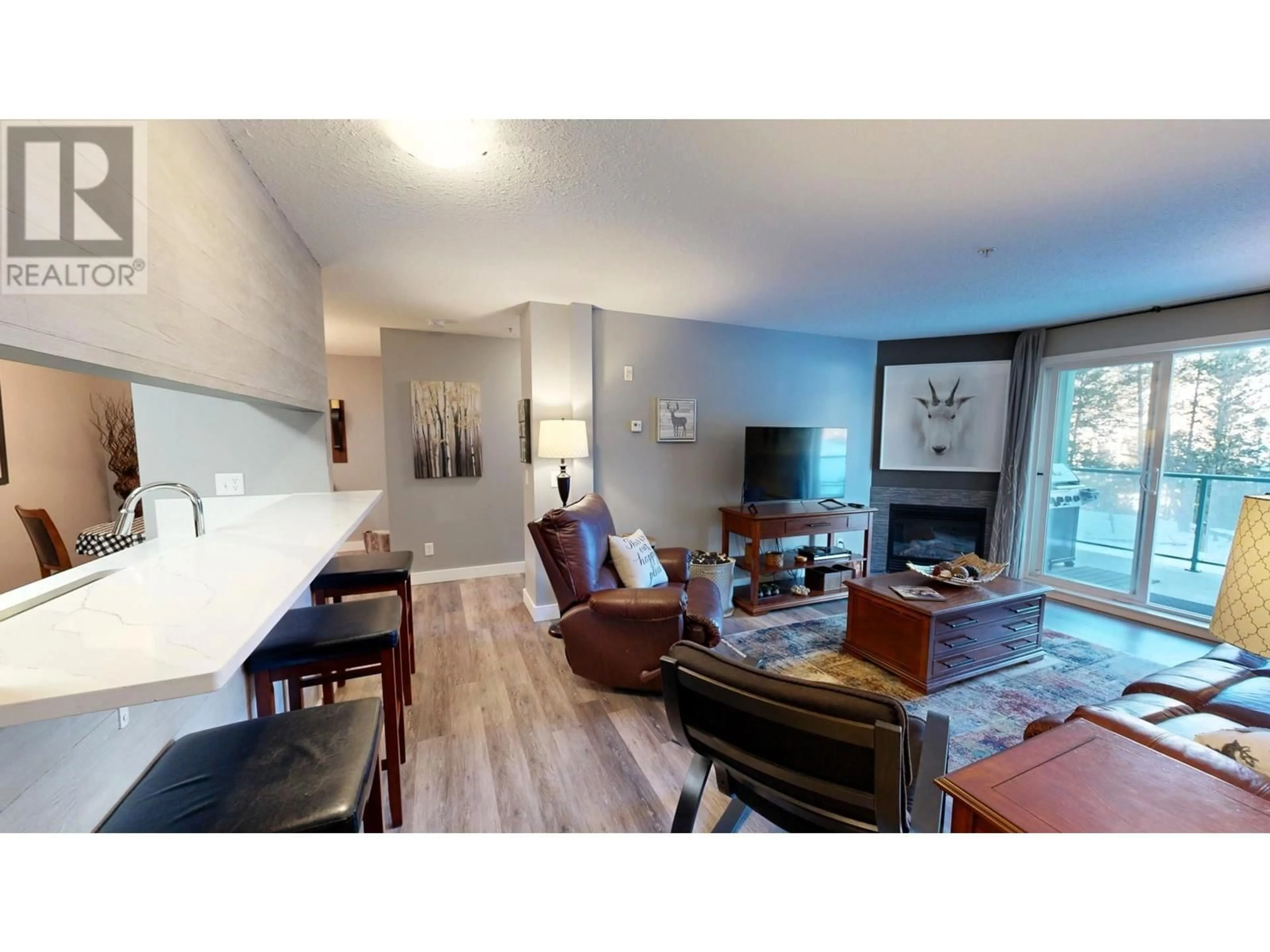 Living room with furniture, wood/laminate floor for 4765 FORSTERS LANDING Road Unit# 108, Radium Hot Springs British Columbia V0A1M0