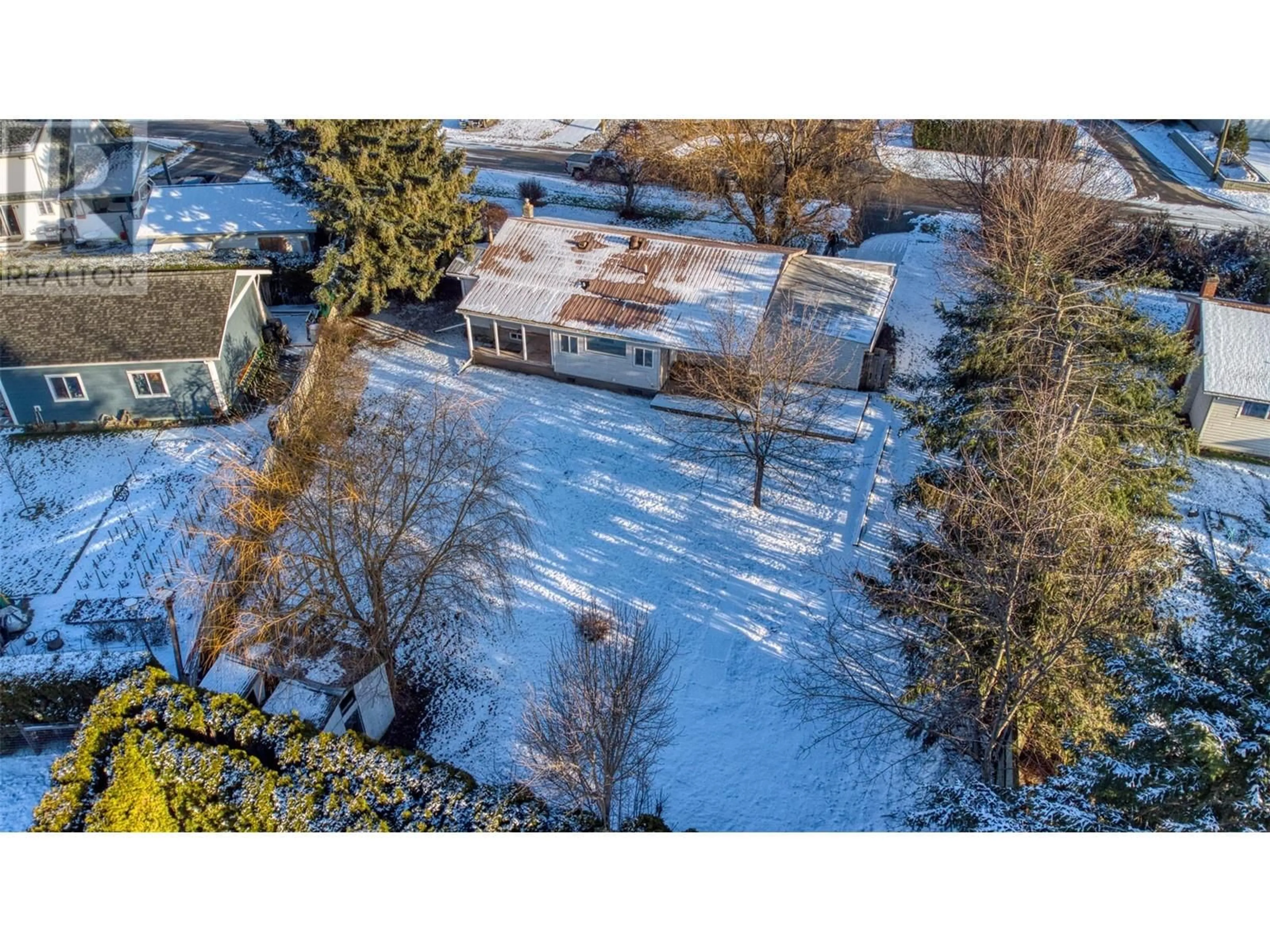 A pic from outside/outdoor area/front of a property/back of a property/a pic from drone, street for 108 Riverdale Drive, Enderby British Columbia V0E1V2