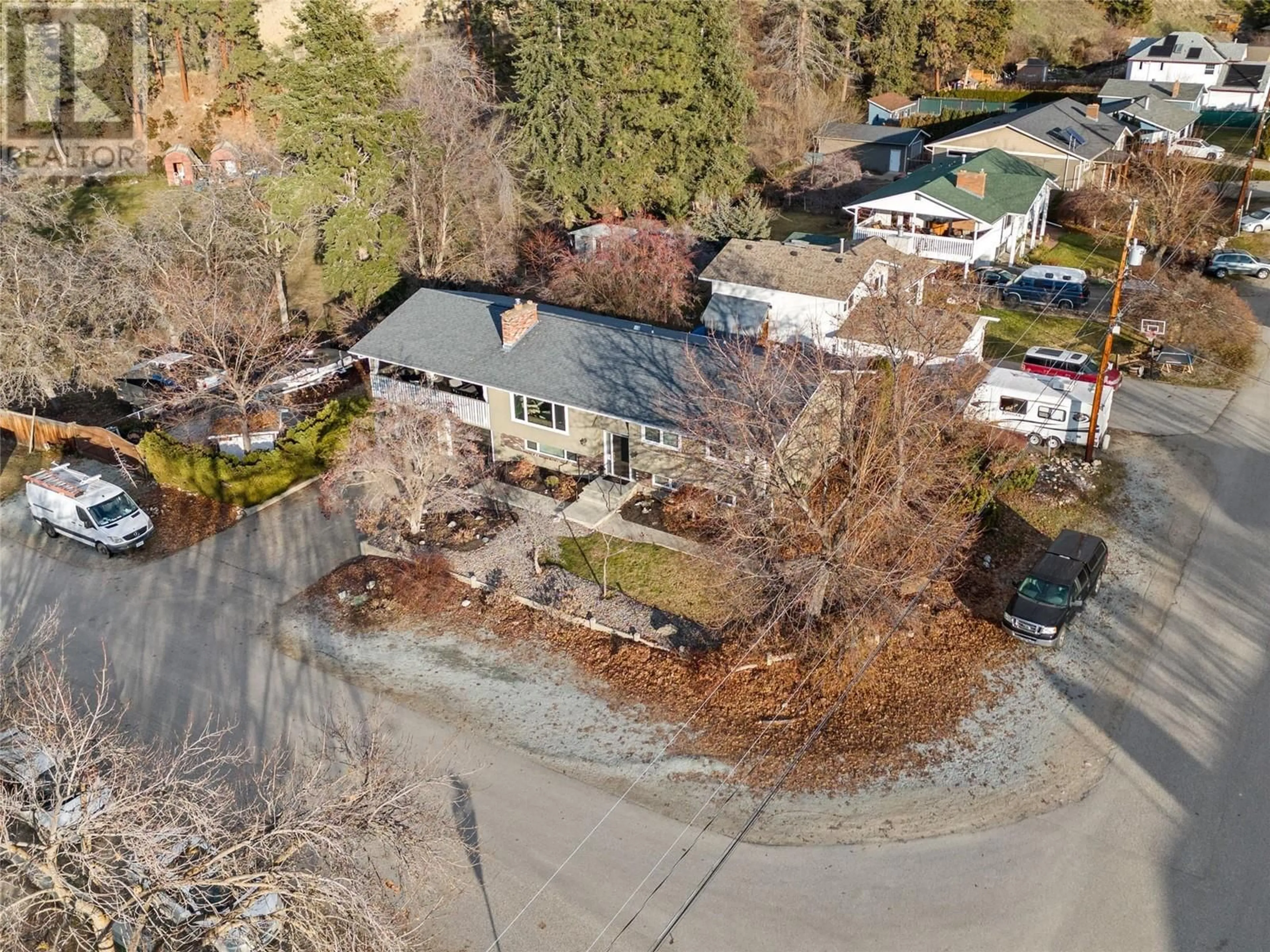 A pic from outside/outdoor area/front of a property/back of a property/a pic from drone, street for 4645 Barton Street, Kelowna British Columbia V1W2B4