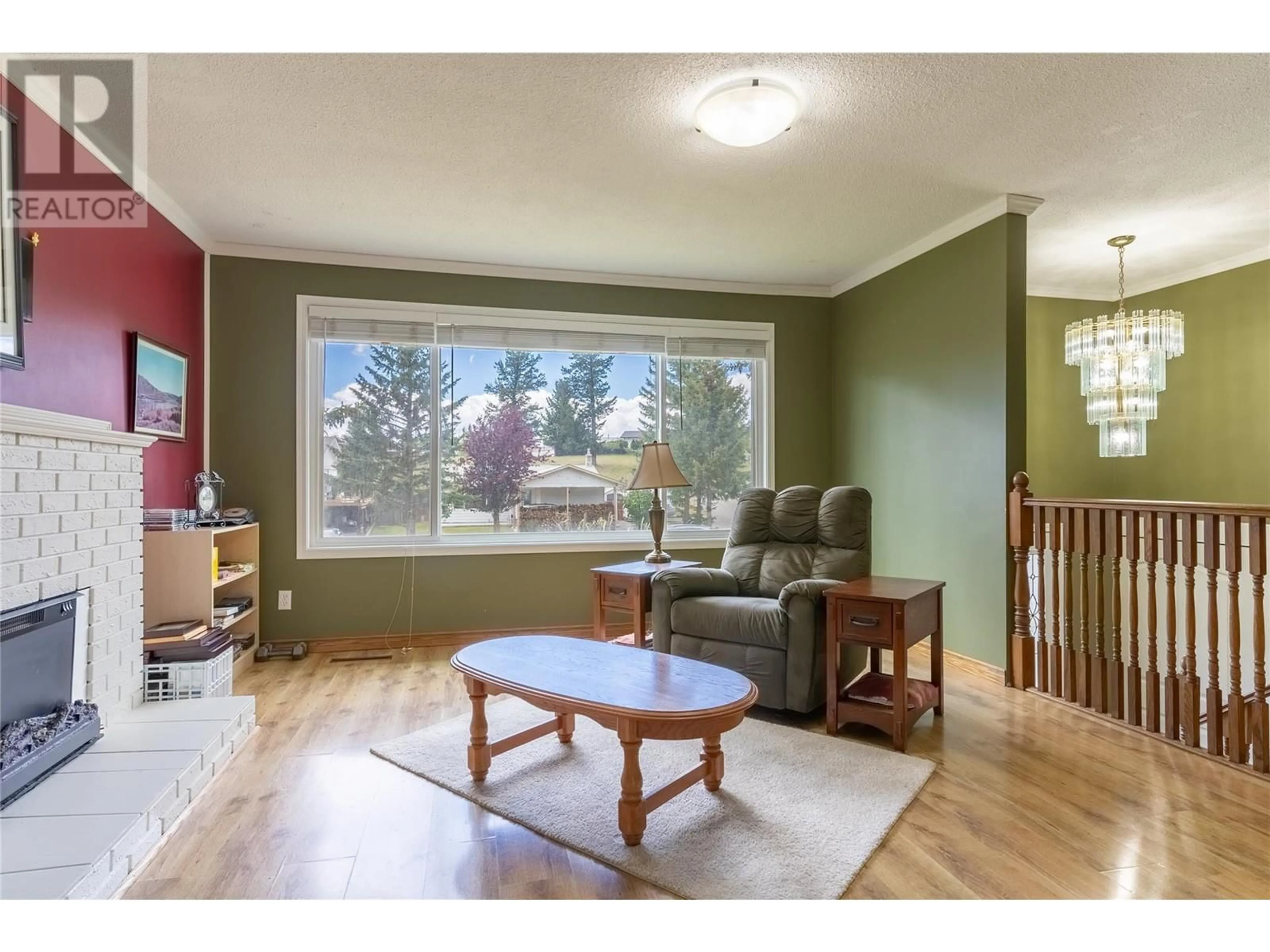 Living room with furniture, wood/laminate floor for 21 GALENA Avenue, Logan Lake British Columbia V0K1W0