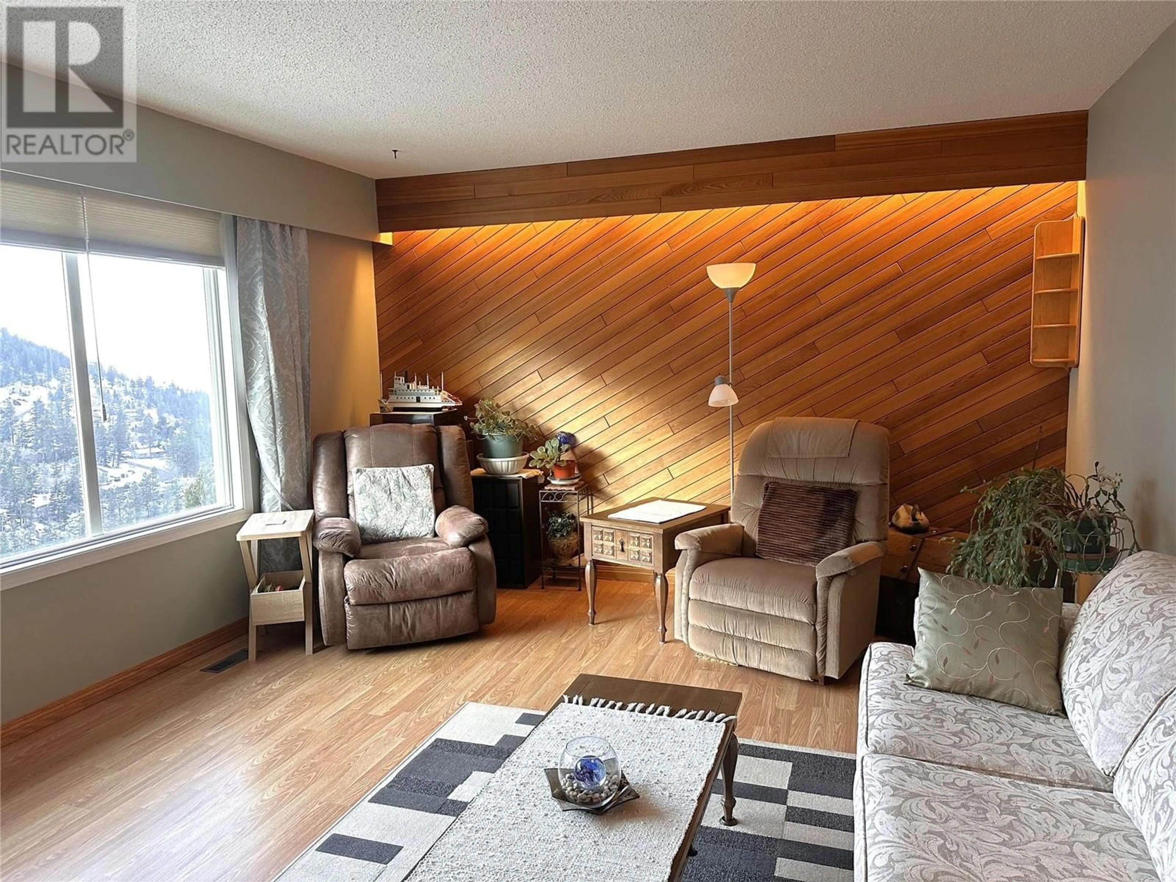 Living room with furniture, wood/laminate floor for 1249 HIGHRIDGE Drive, Kamloops British Columbia V2C5S5