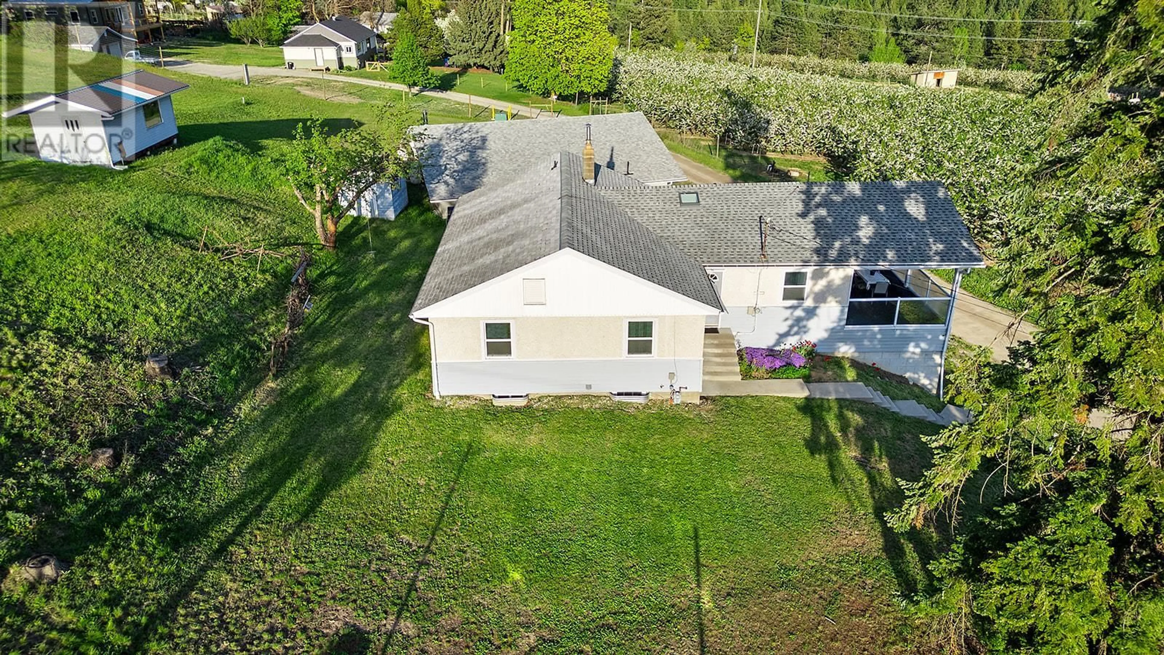 A pic from outside/outdoor area/front of a property/back of a property/a pic from drone, street for 3820 38TH  N AVENUE, Creston British Columbia V0B1G1