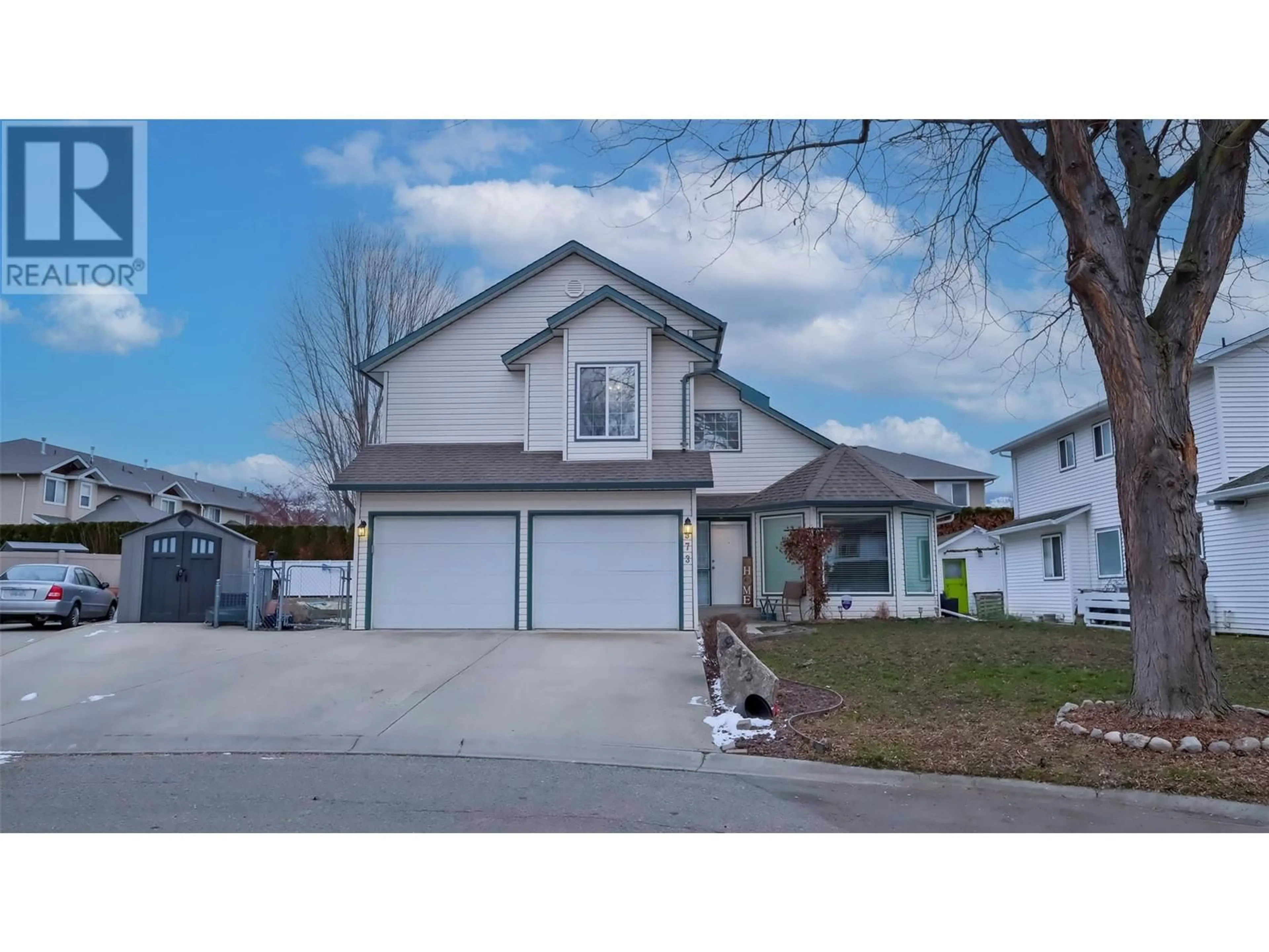 Home with vinyl exterior material, street for 973 Fizet Court, Kelowna British Columbia V1X7P6