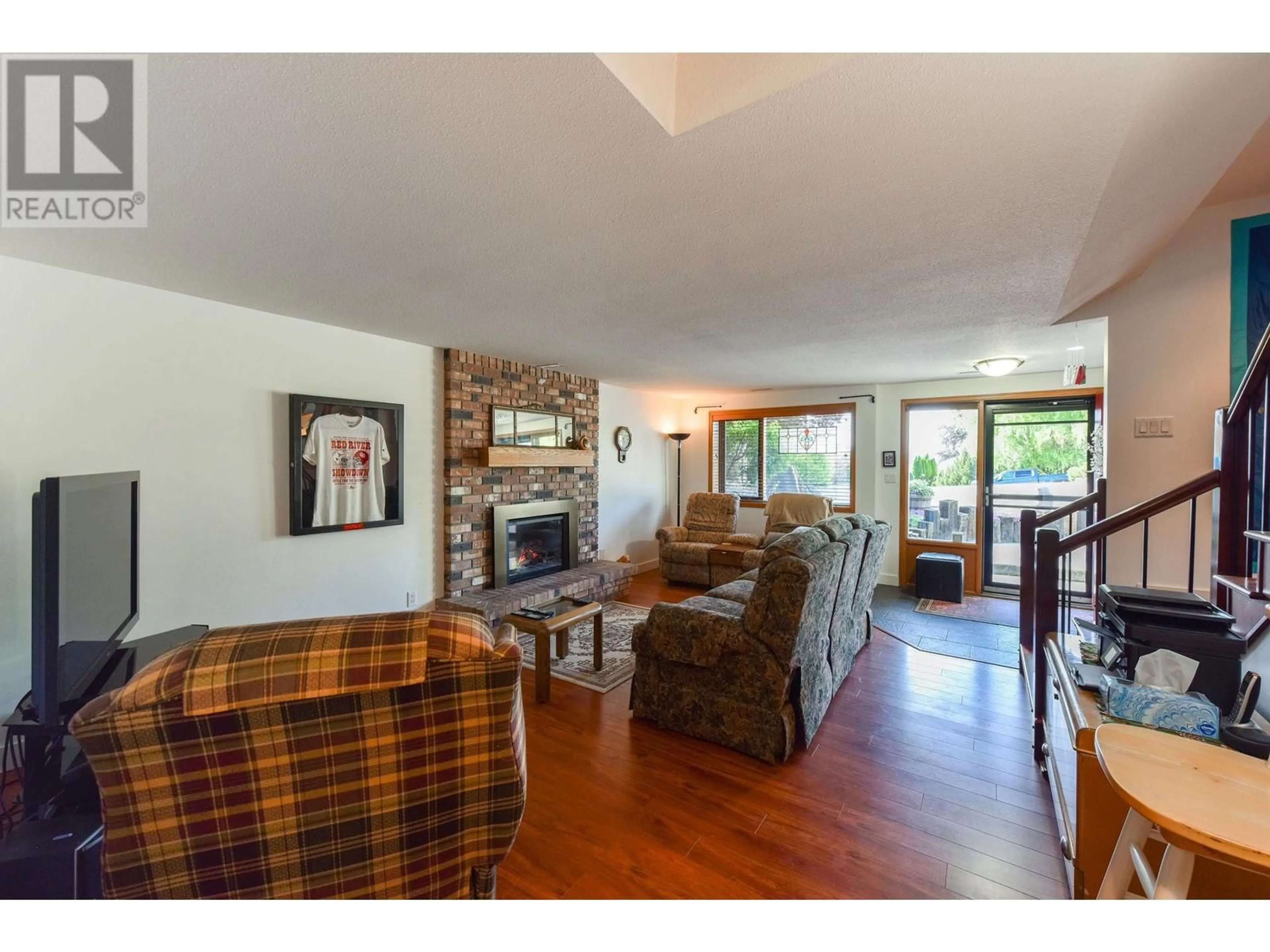 Living room with furniture, wood/laminate floor for 124 Millar Place, Penticton British Columbia V2A8A1