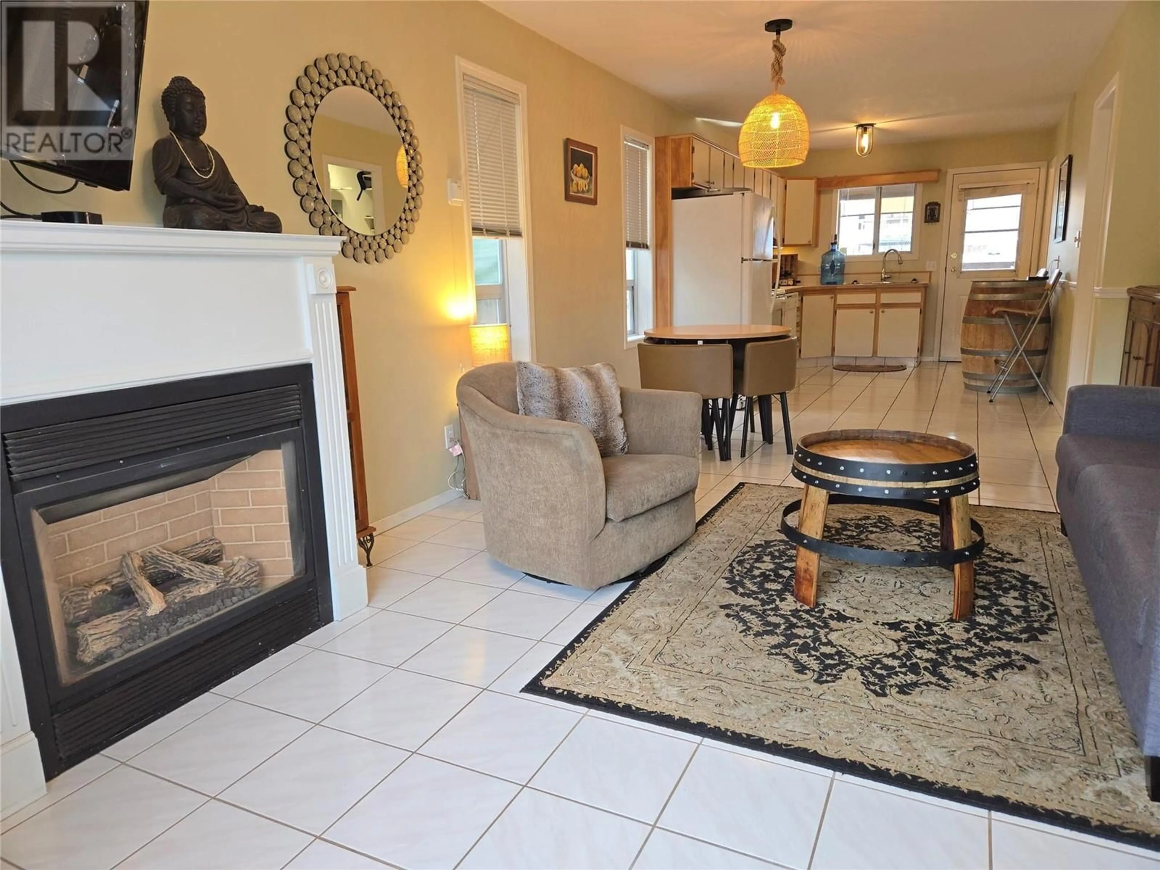 Living room with furniture, ceramic/tile floor for 6015 MAPLE Drive Unit# 1, Osoyoos British Columbia V0H1V3