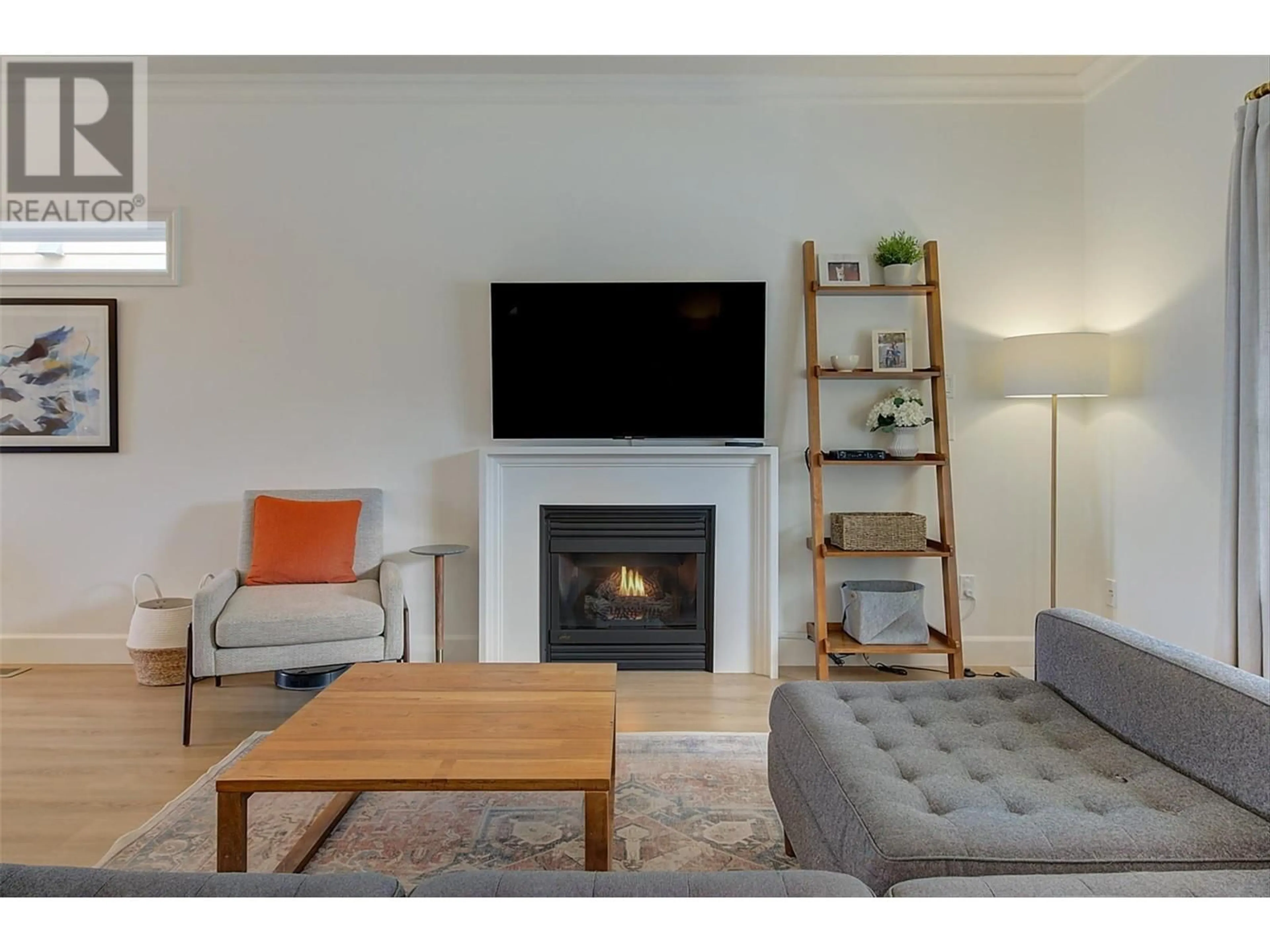 Living room with furniture, wood/laminate floor for 394 McCarren Avenue, Kelowna British Columbia V1W4W3