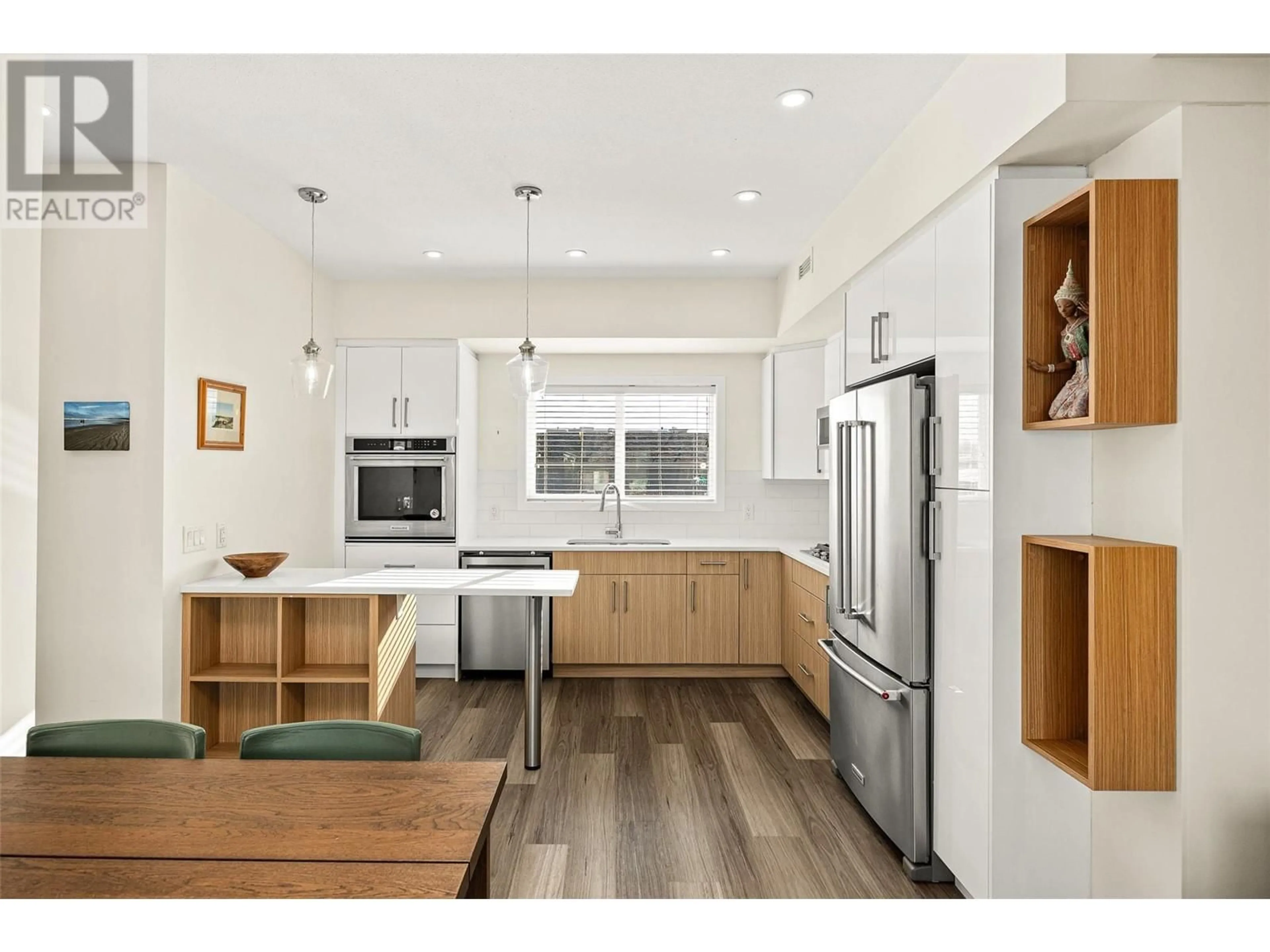 Open concept kitchen, wood/laminate floor for 701 Morrison Avenue Unit# 5, Kelowna British Columbia V1Y2P9