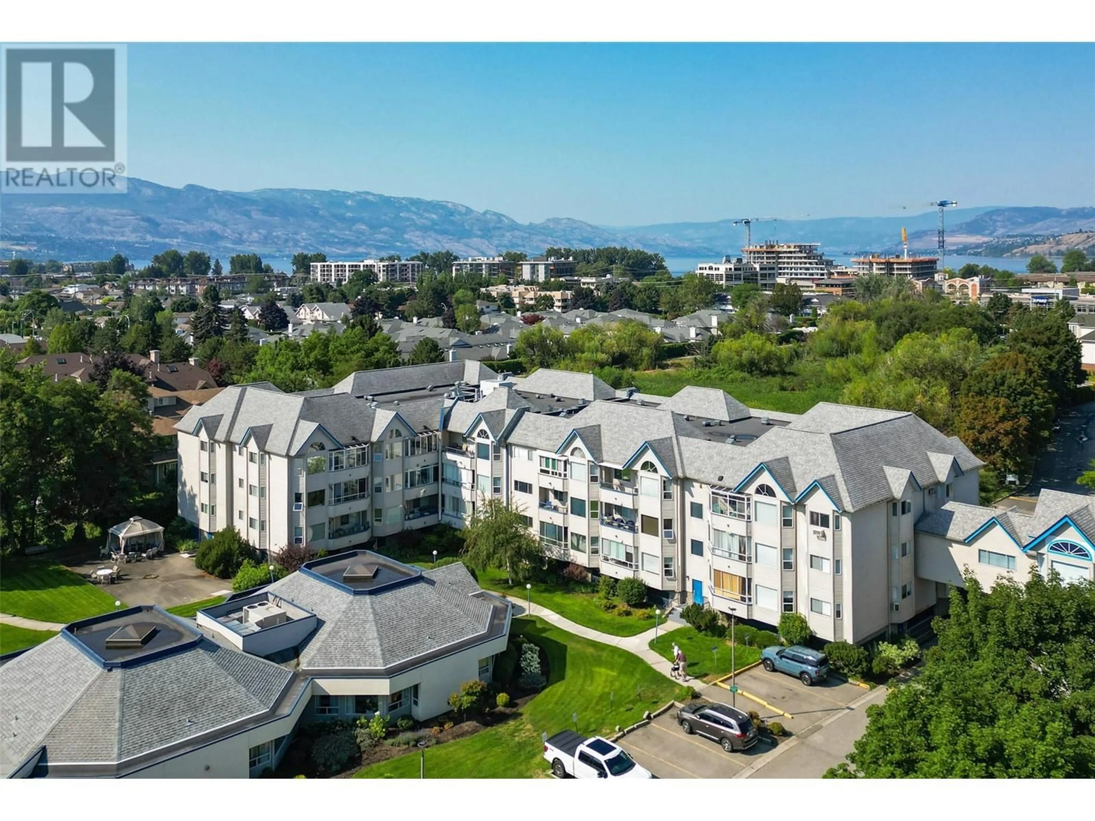 A pic from outside/outdoor area/front of a property/back of a property/a pic from drone, mountain view for 3283 Casorso Road Unit# 308, Kelowna British Columbia V1W3L6