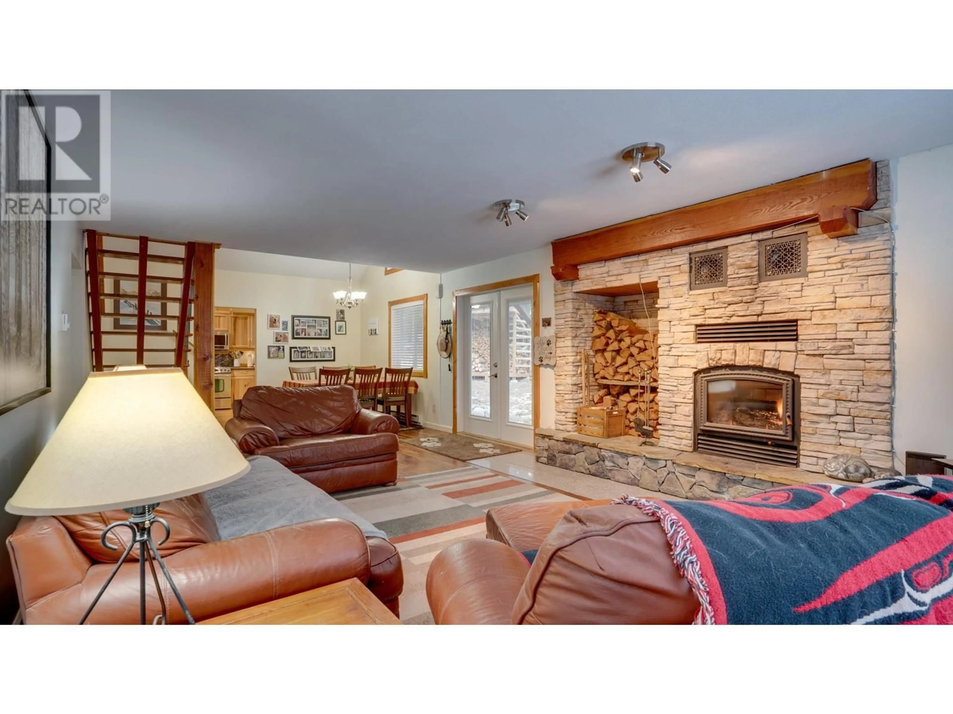 Living room with furniture, ceramic/tile floor for 810 FIRWOOD ROAD, Kelowna British Columbia V1Z3V5