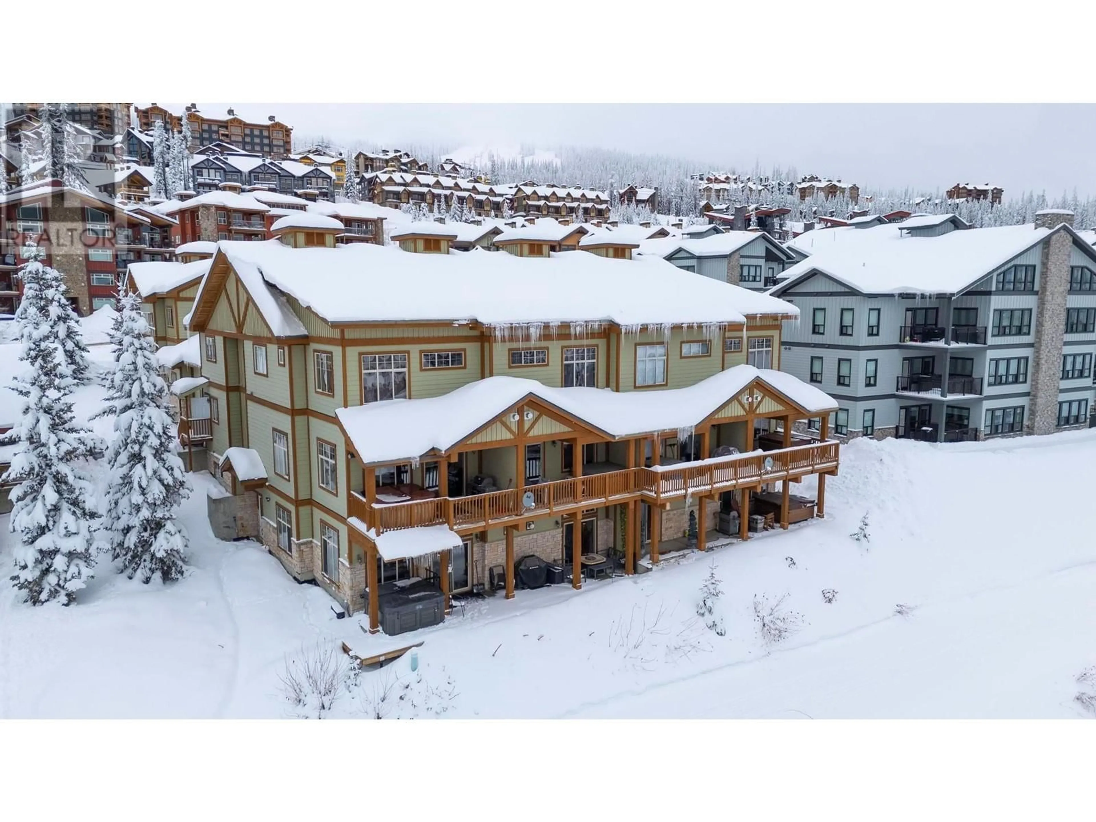 A pic from outside/outdoor area/front of a property/back of a property/a pic from drone, building for 2 - 5045 SNOWBIRD WAY, Big White British Columbia V1P1P3