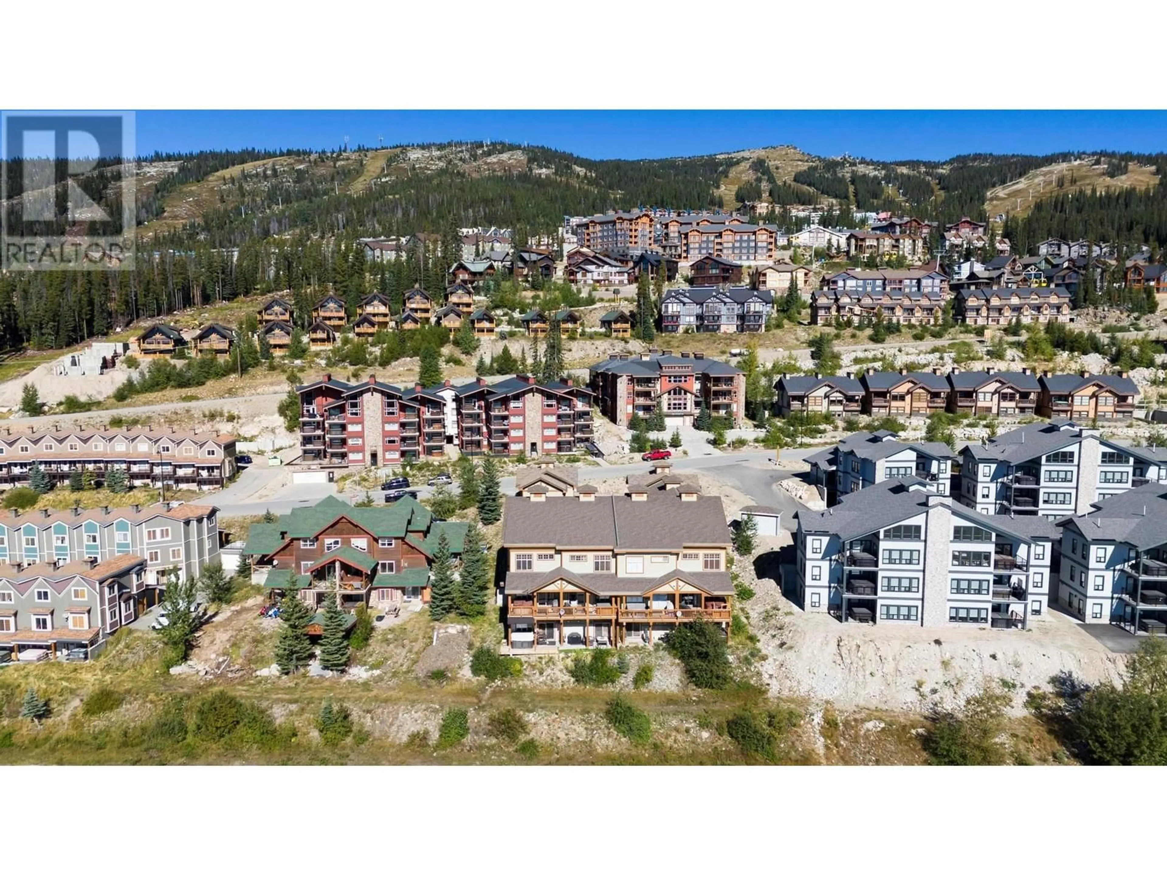 A pic from outside/outdoor area/front of a property/back of a property/a pic from drone, mountain view for 2 - 5045 SNOWBIRD WAY, Big White British Columbia V1P1P3