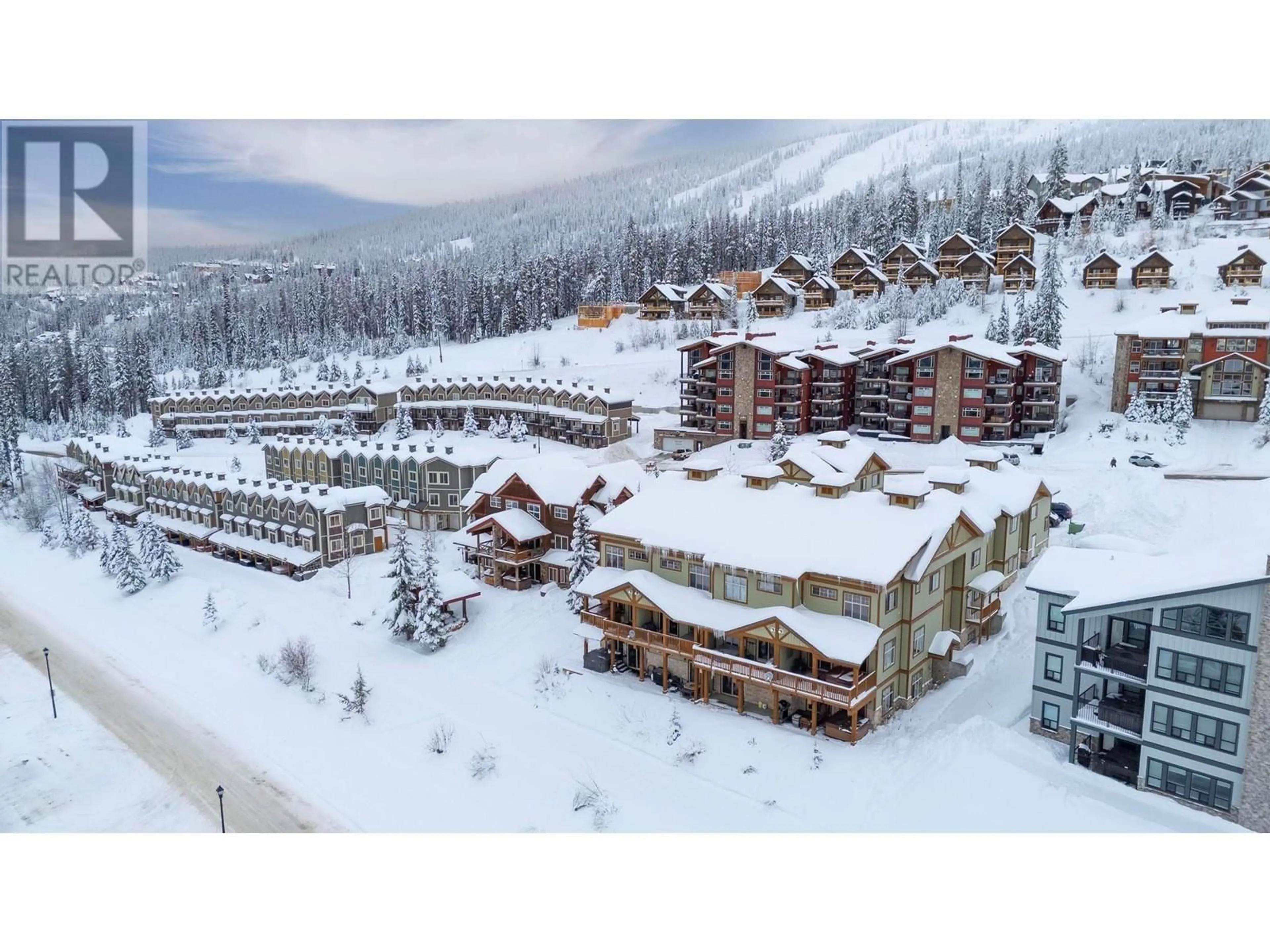 A pic from outside/outdoor area/front of a property/back of a property/a pic from drone, mountain view for 2 - 5045 SNOWBIRD WAY, Big White British Columbia V1P1P3
