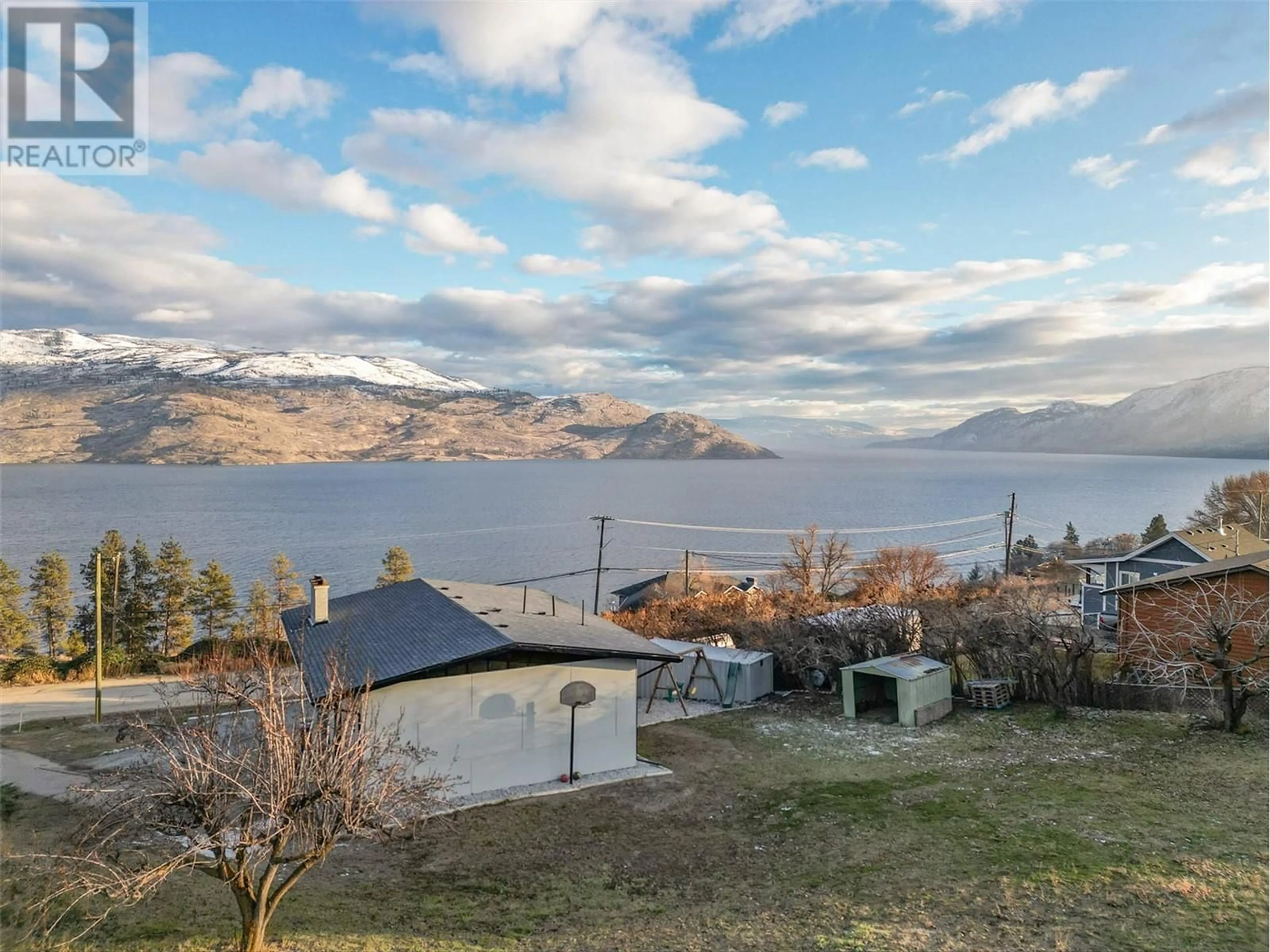 A pic from outside/outdoor area/front of a property/back of a property/a pic from drone, water/lake/river/ocean view for 6178 Lipsett Avenue, Peachland British Columbia V0H1X7