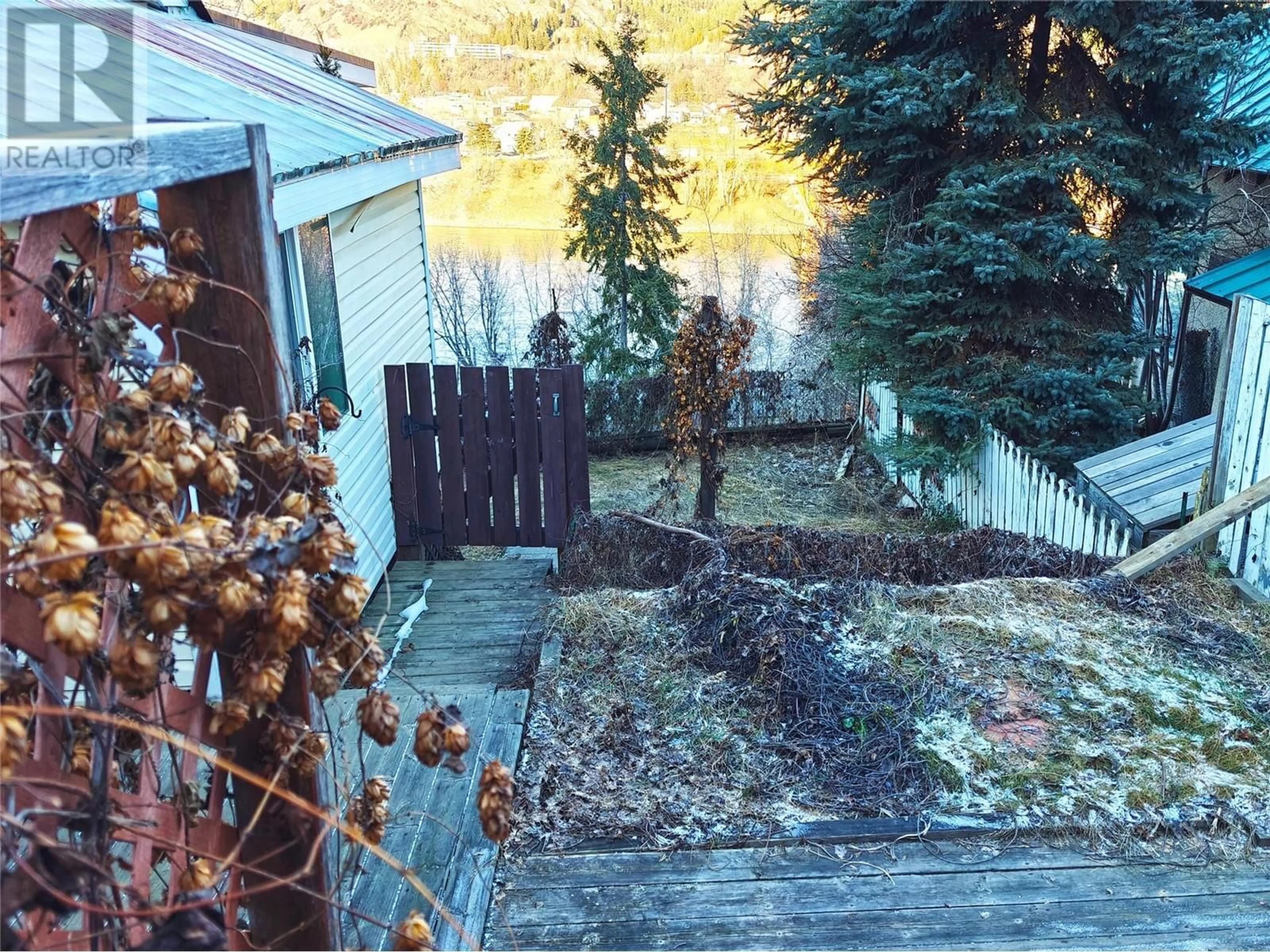 A pic from outside/outdoor area/front of a property/back of a property/a pic from drone, water/lake/river/ocean view for 2087 Topping Street, Trail British Columbia V1R4G6