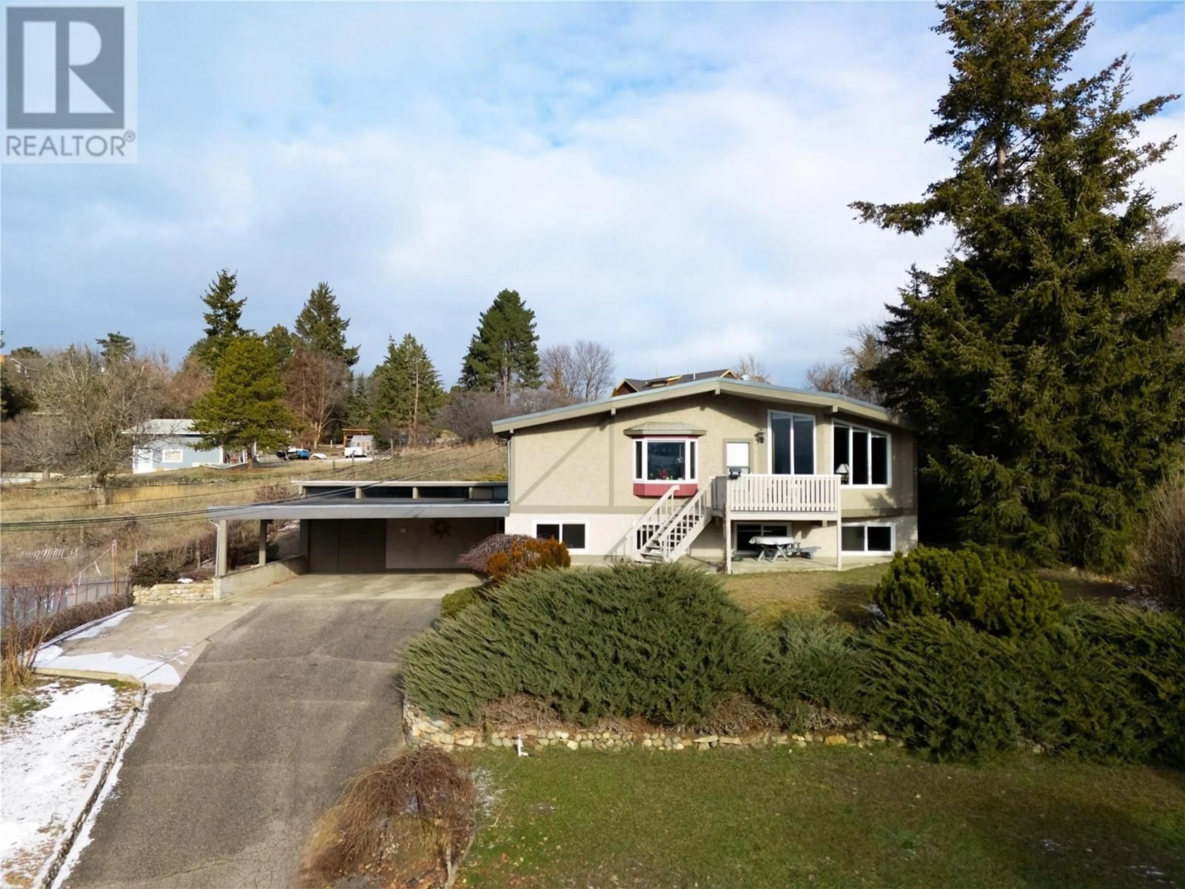 A pic from outside/outdoor area/front of a property/back of a property/a pic from drone, street for 9713 Venables Drive, Coldstream British Columbia V1B2K1