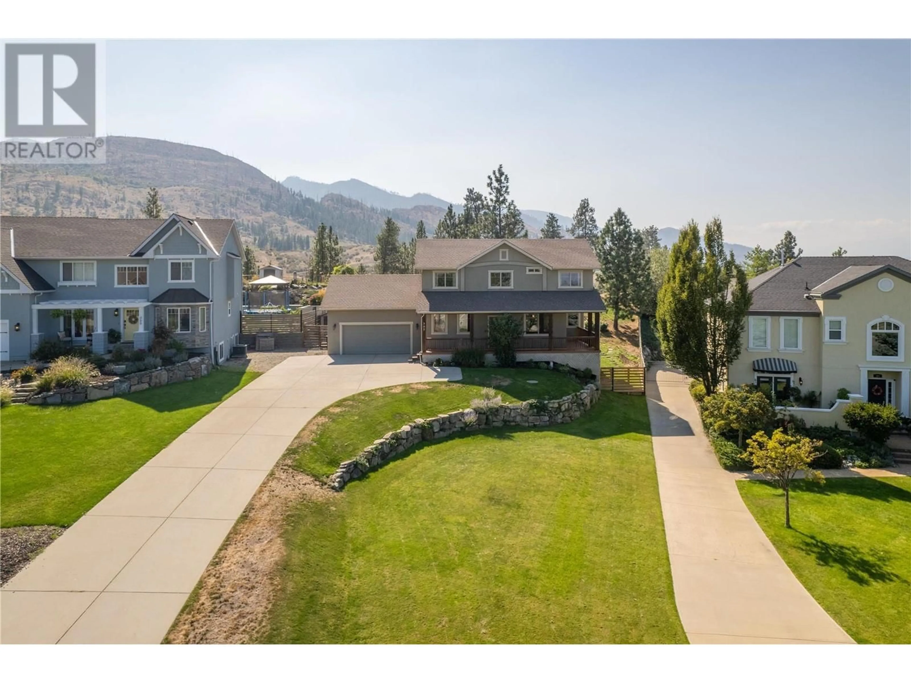 A pic from outside/outdoor area/front of a property/back of a property/a pic from drone, mountain view for 305 TANAGER DRIVE, Kelowna British Columbia V1W4K5