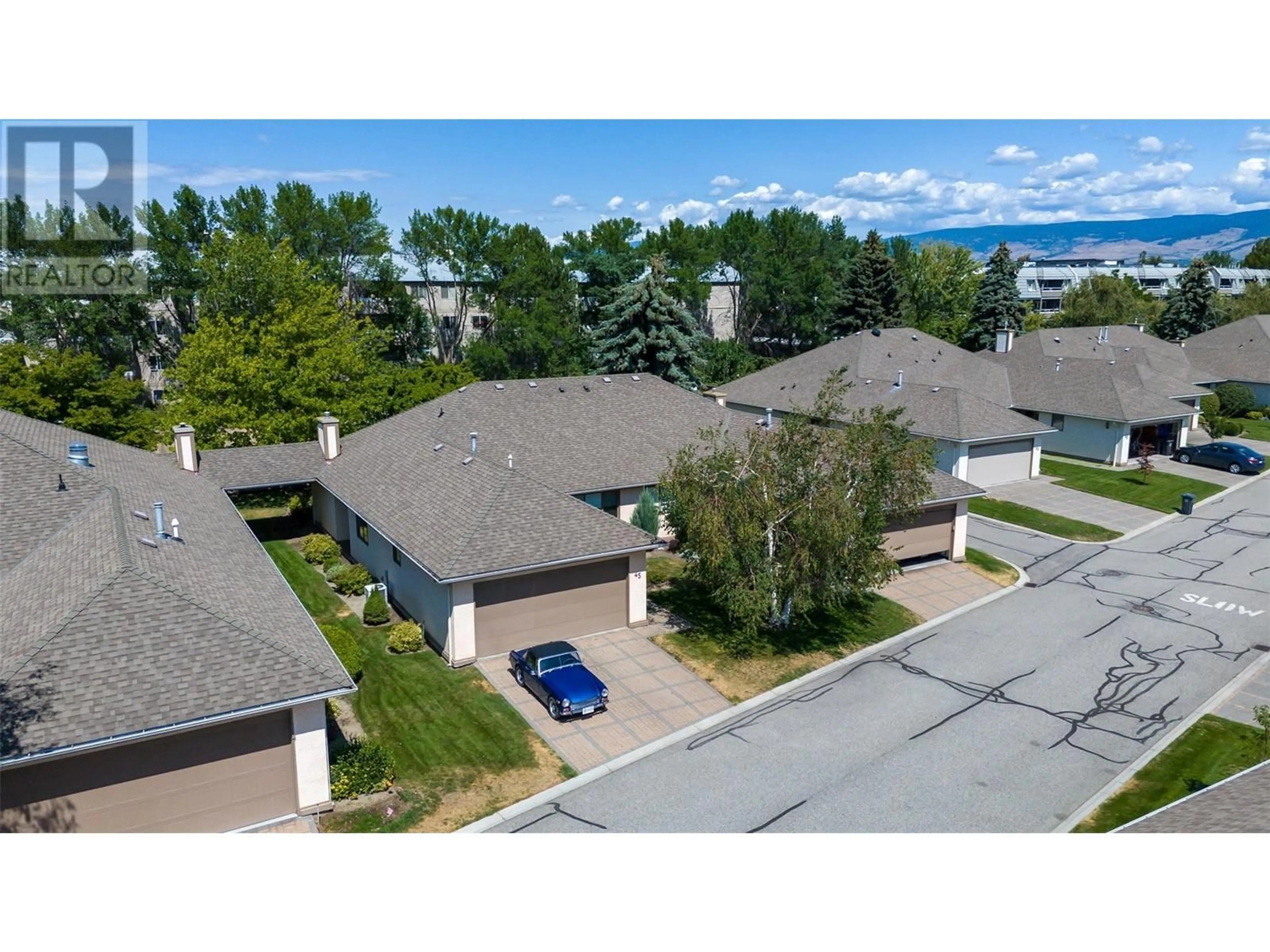 A pic from outside/outdoor area/front of a property/back of a property/a pic from drone, unknown for 950 Lanfranco Road Unit# 45, Kelowna British Columbia V1W3X3