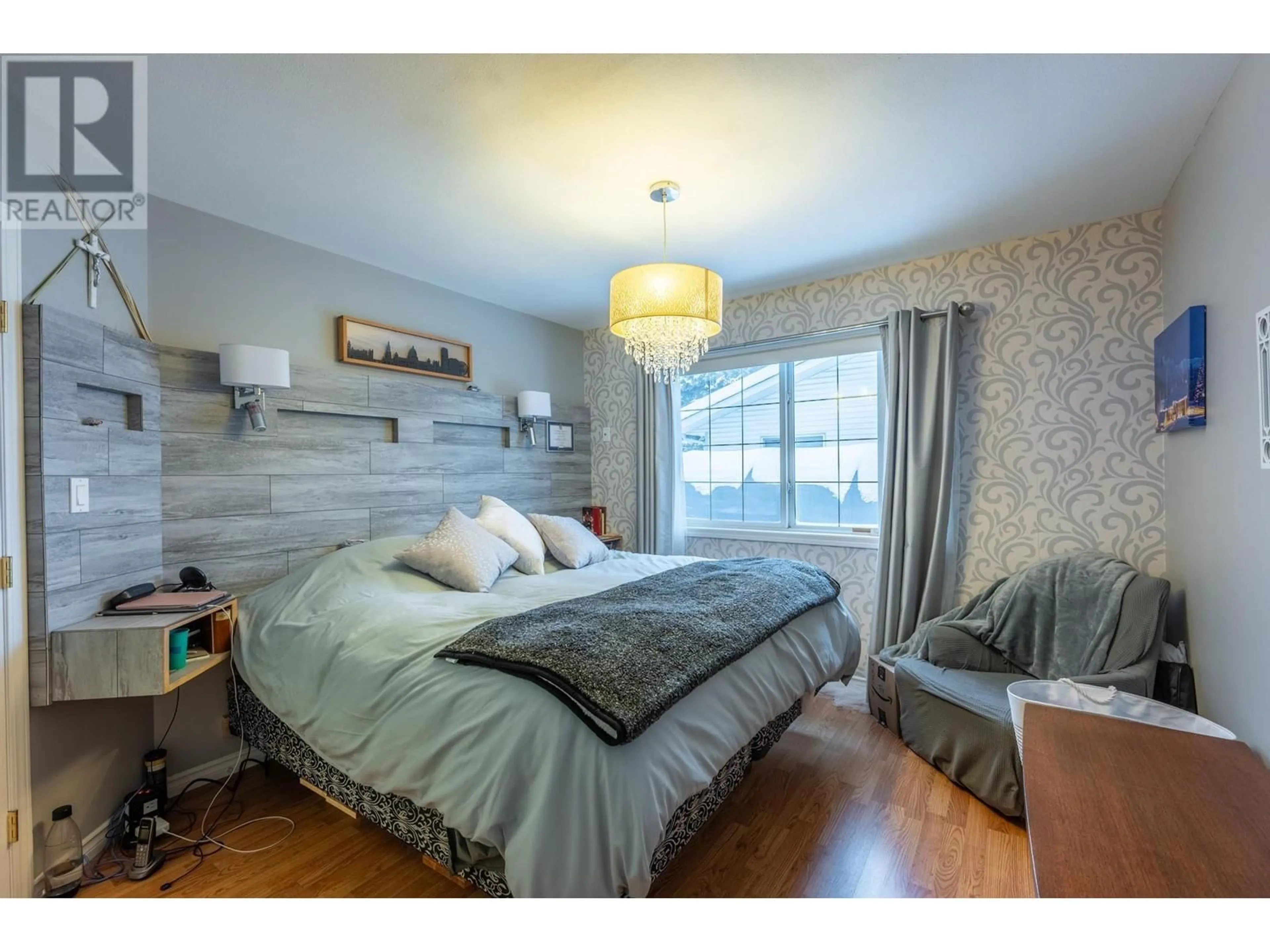 Bedroom with bed, wood/laminate floor for 1505 Cedar Street, Golden British Columbia V0A1H6