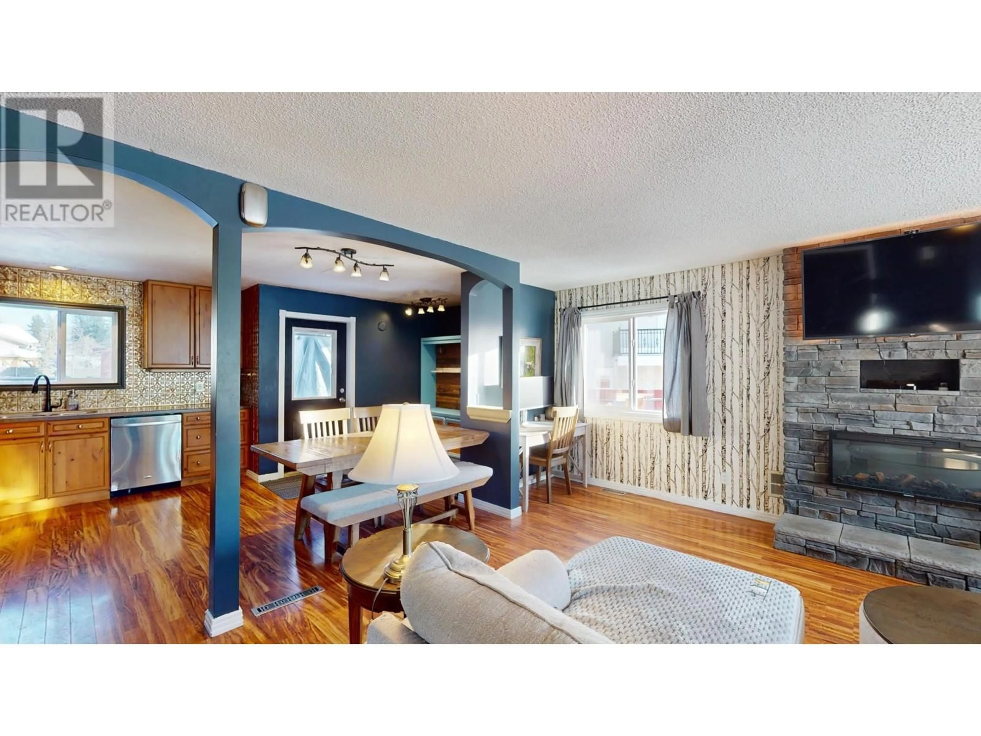 Living room with furniture, wood/laminate floor for 54 Cassiar Drive, Elkford British Columbia V0B1H0