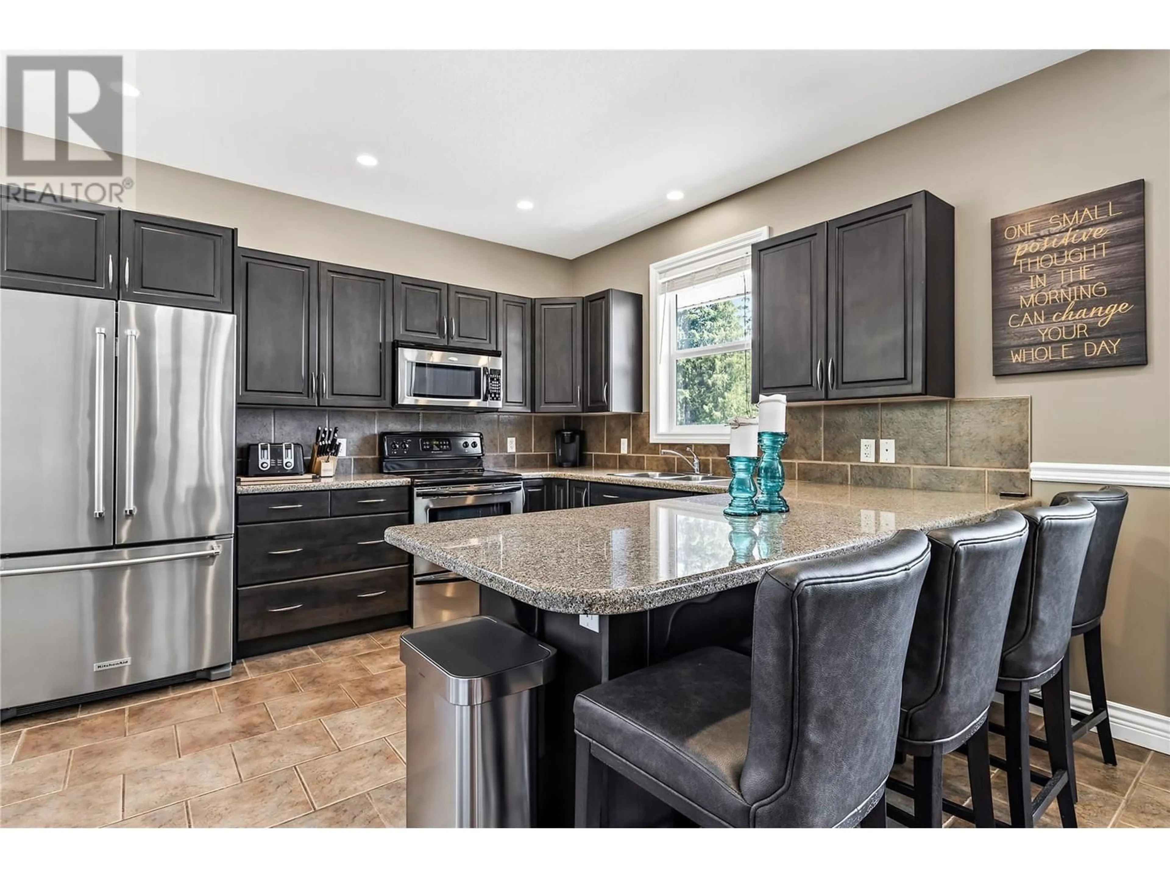 Open concept kitchen, ceramic/tile floor for 1209 Riverside Avenue Unit# F, Sicamous British Columbia V0E2V0